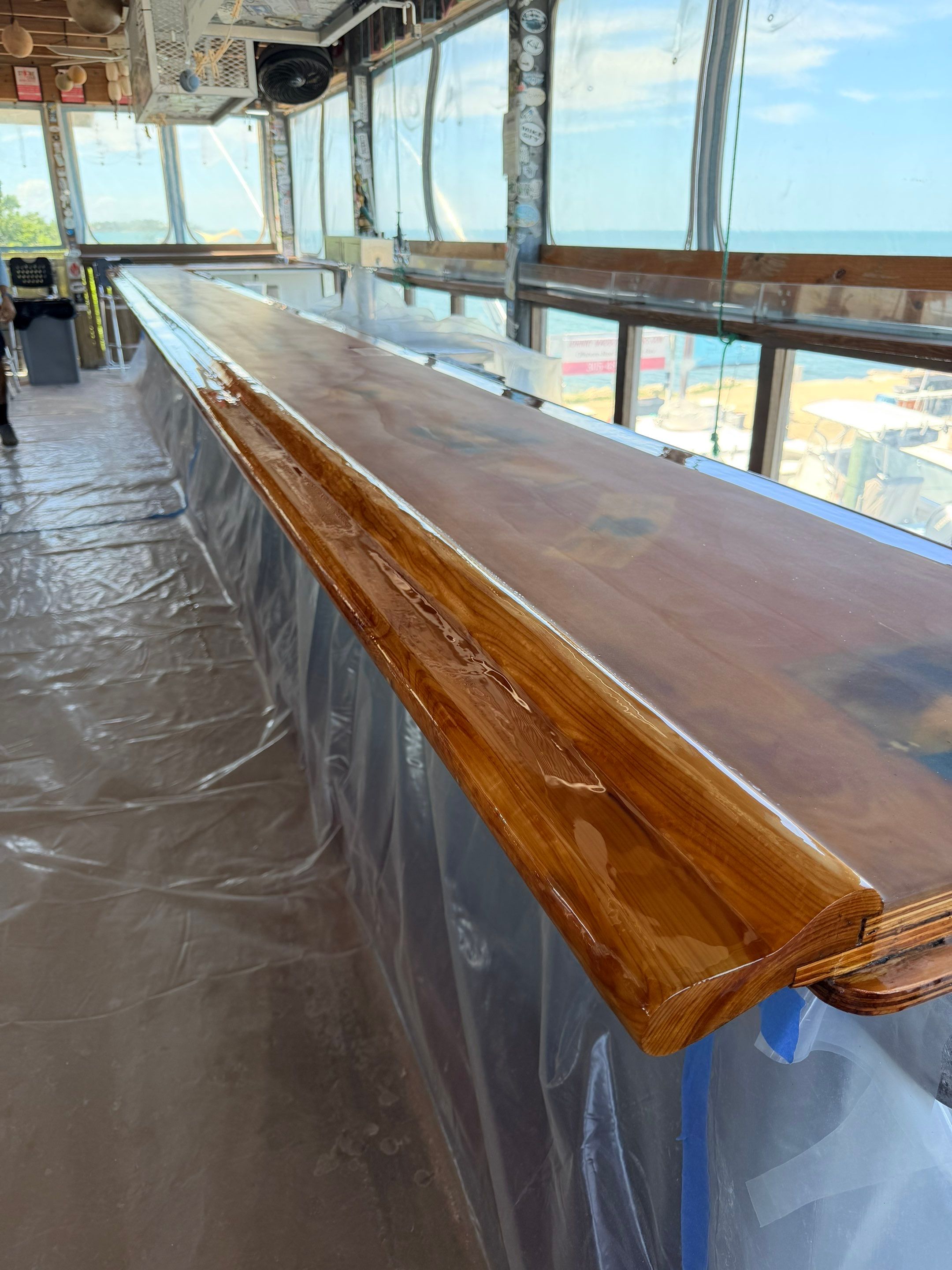 LOCAL FAMOUS FL KEYS BAR REFINISH by Tropical Epoxy Coatings & Creations LLC 