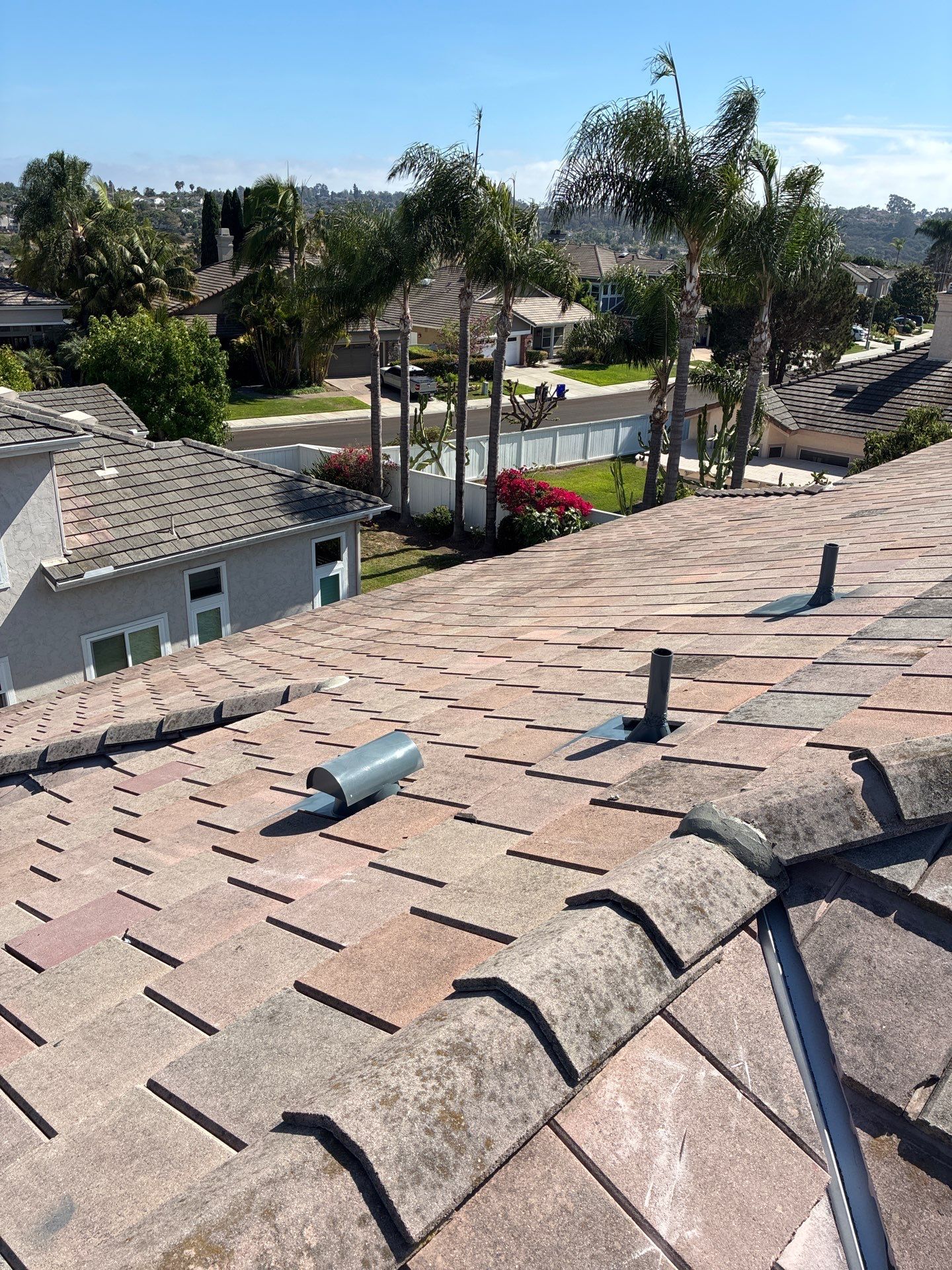 Carlsbad Concrete Tile Roof Replacement with Copper Flashing and Skylights by Reliable Roofing San Diego Inc.