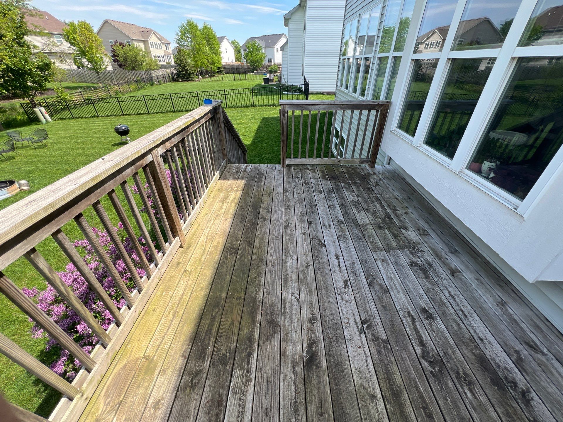 wood deck cleaning and staining by Northern Power Washing LLC.
