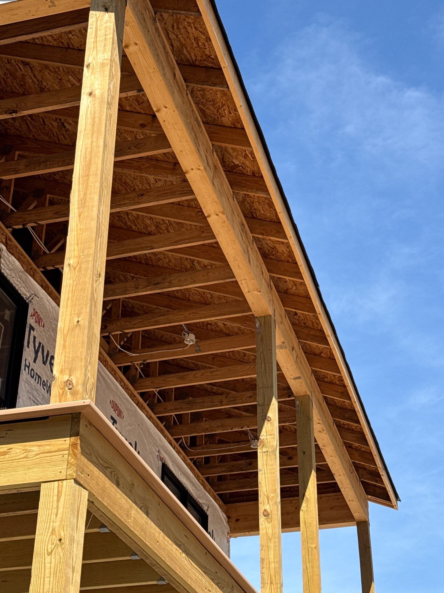 Two-Story Custom Home With Board and Batten Siding by Cade Construction