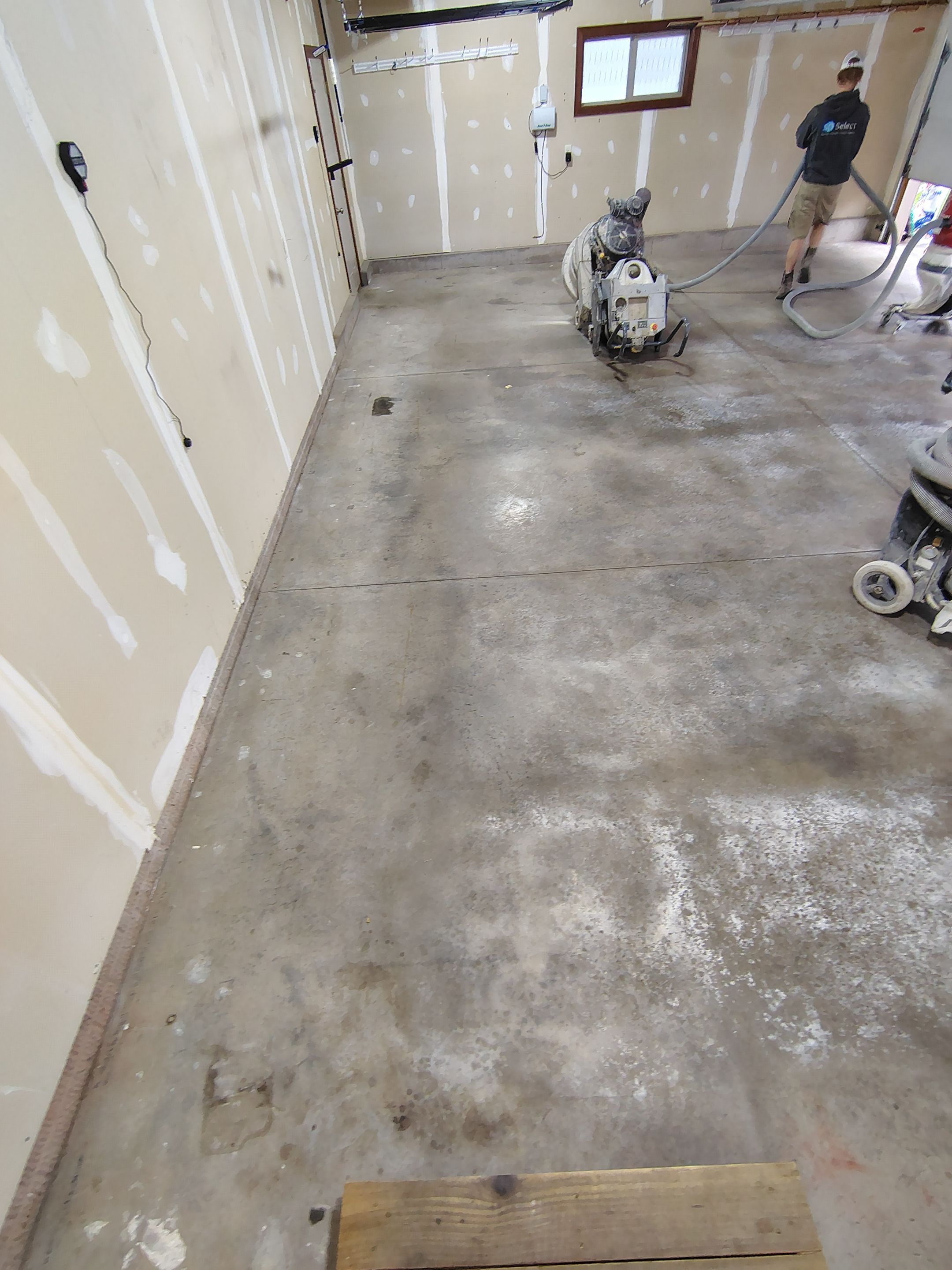 Multi-Car Garage Concrete Coating and Epoxy Finish in Sioux Falls by Select Painting, Coatings & Garage Cabinets