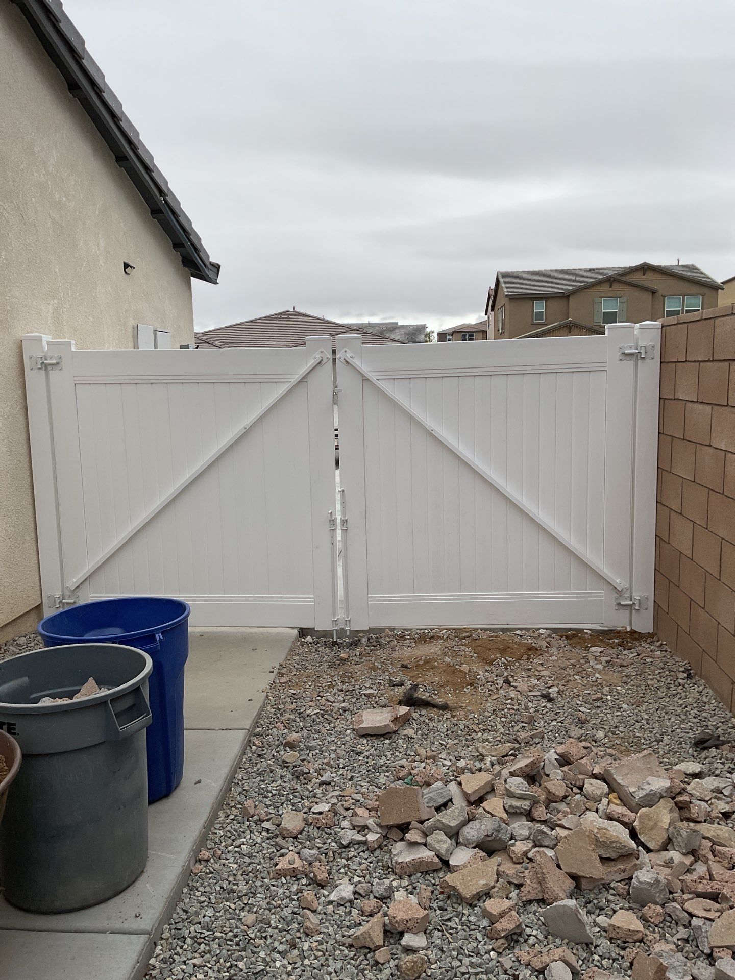 Gate installation using Vinyl by Fence Guys Inc. 