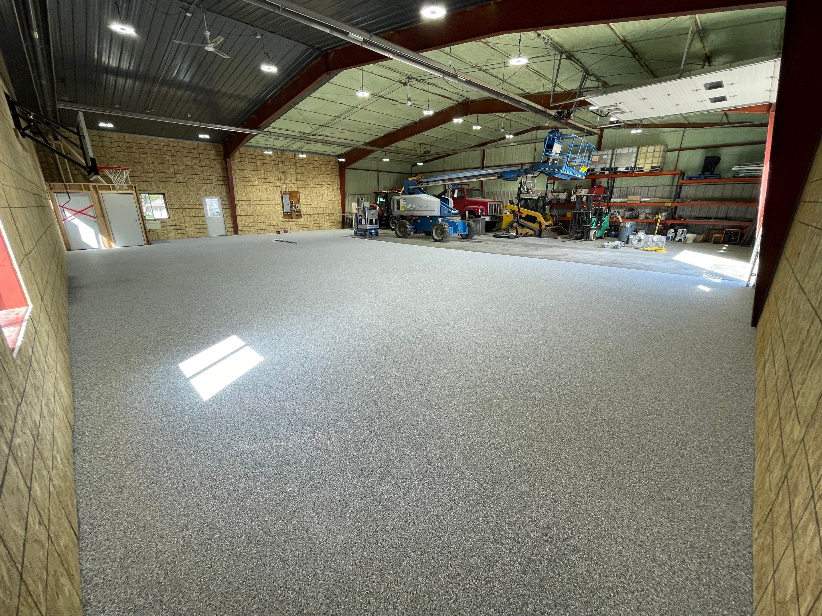 Custom Polyurea Shop Floor with Basketball Court Lines in Rock Valley by Select Painting, Coatings & Garage Cabinets