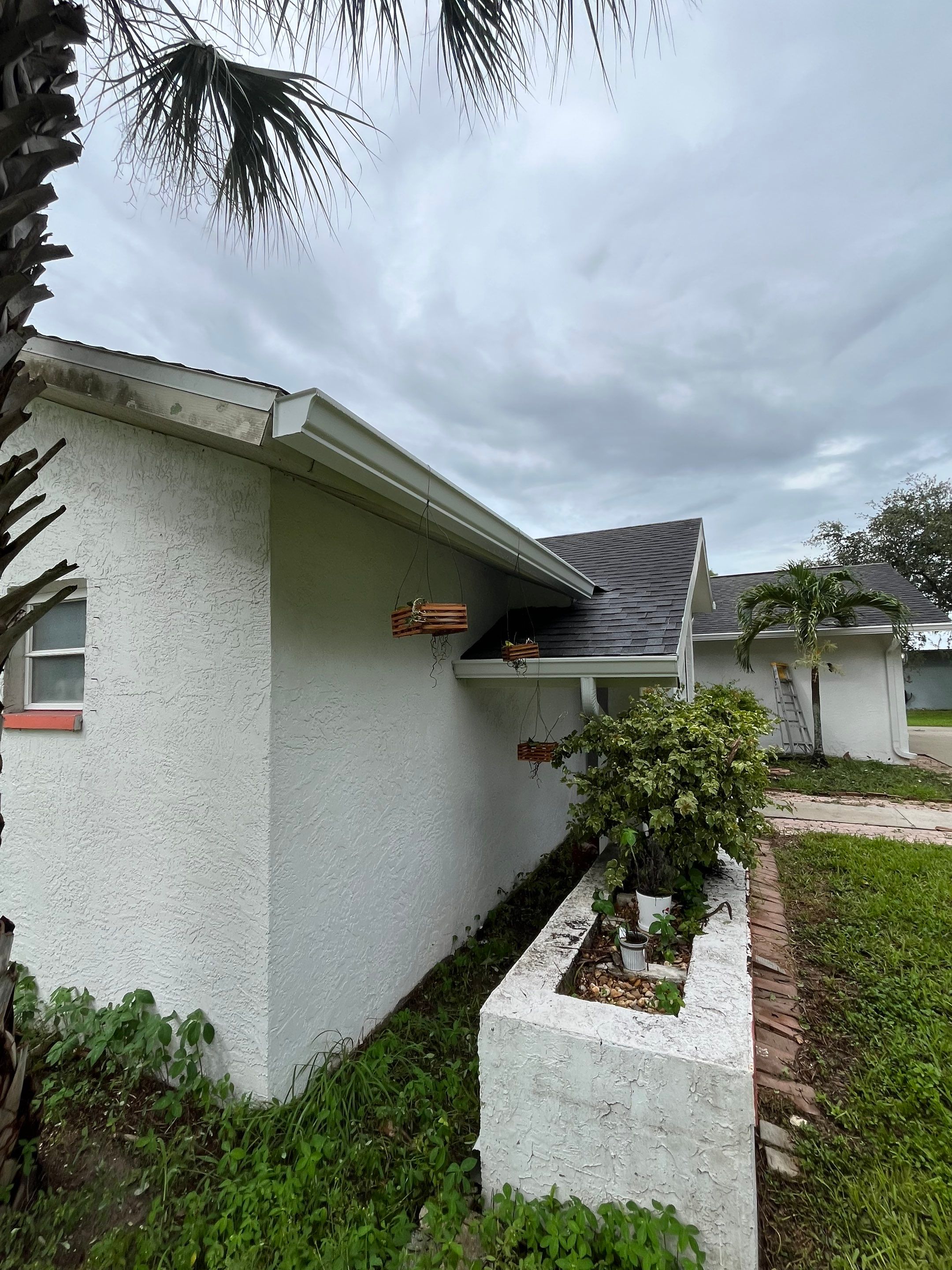 White Seamless Gutters with Splash Guards in North Fort Myers FL by Gutter Professor   by Gutter Professors