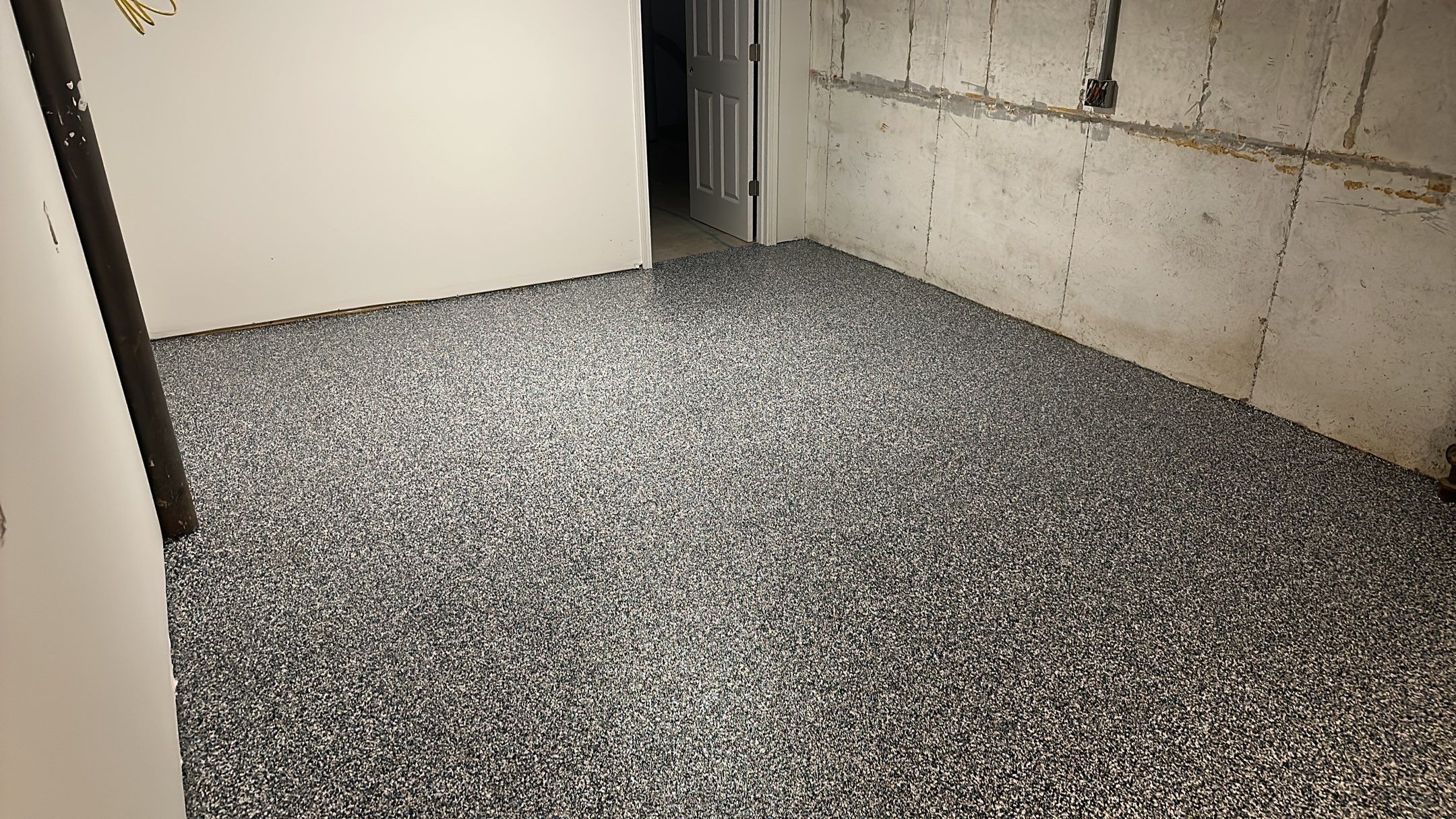 A beautiful Banner Garage Coating in a basement  by Banner Garage