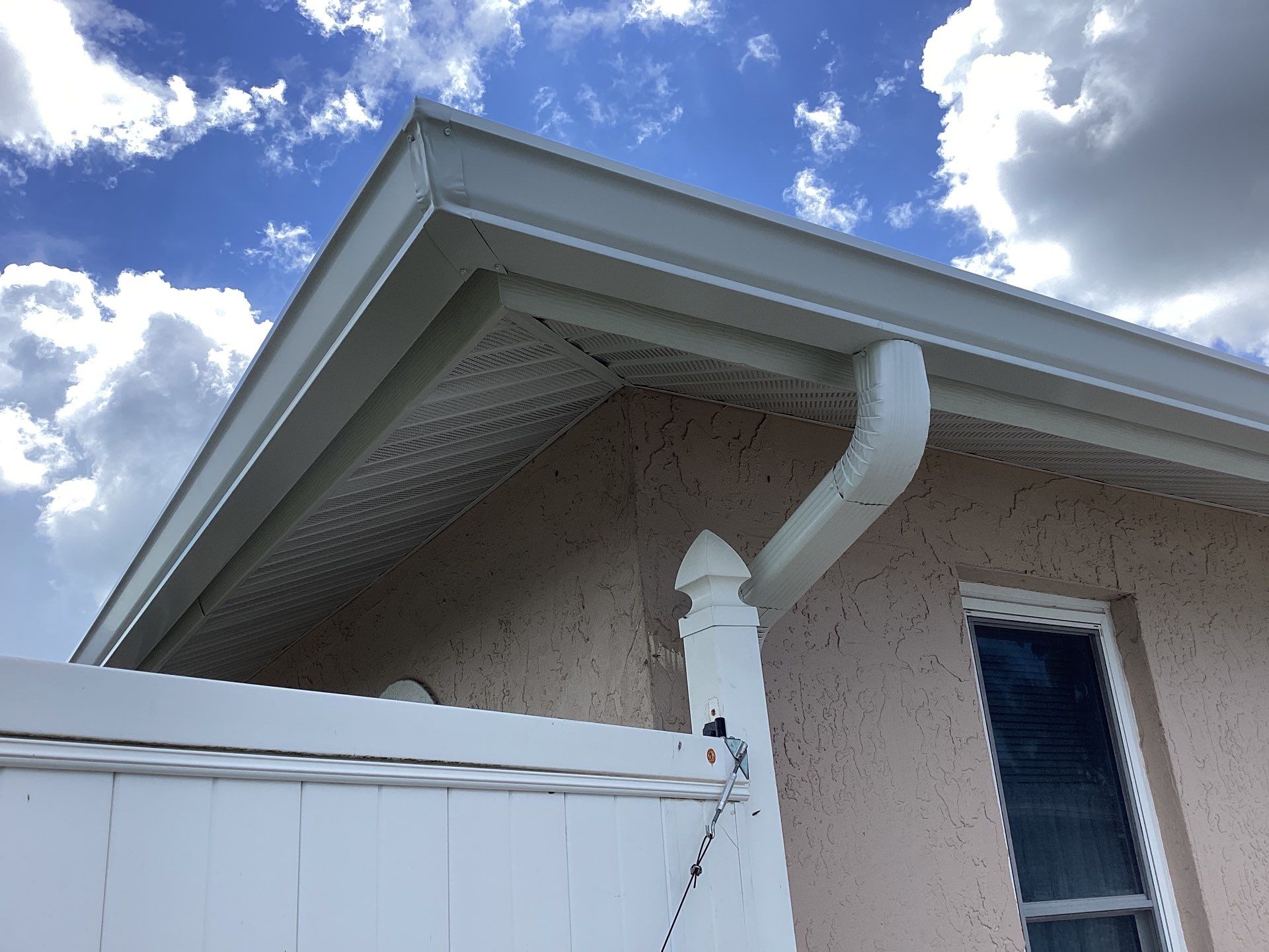 White Seamless Gutters and Splash Guards in Fort Myers FL by Gutter Professor by Gutter Professors