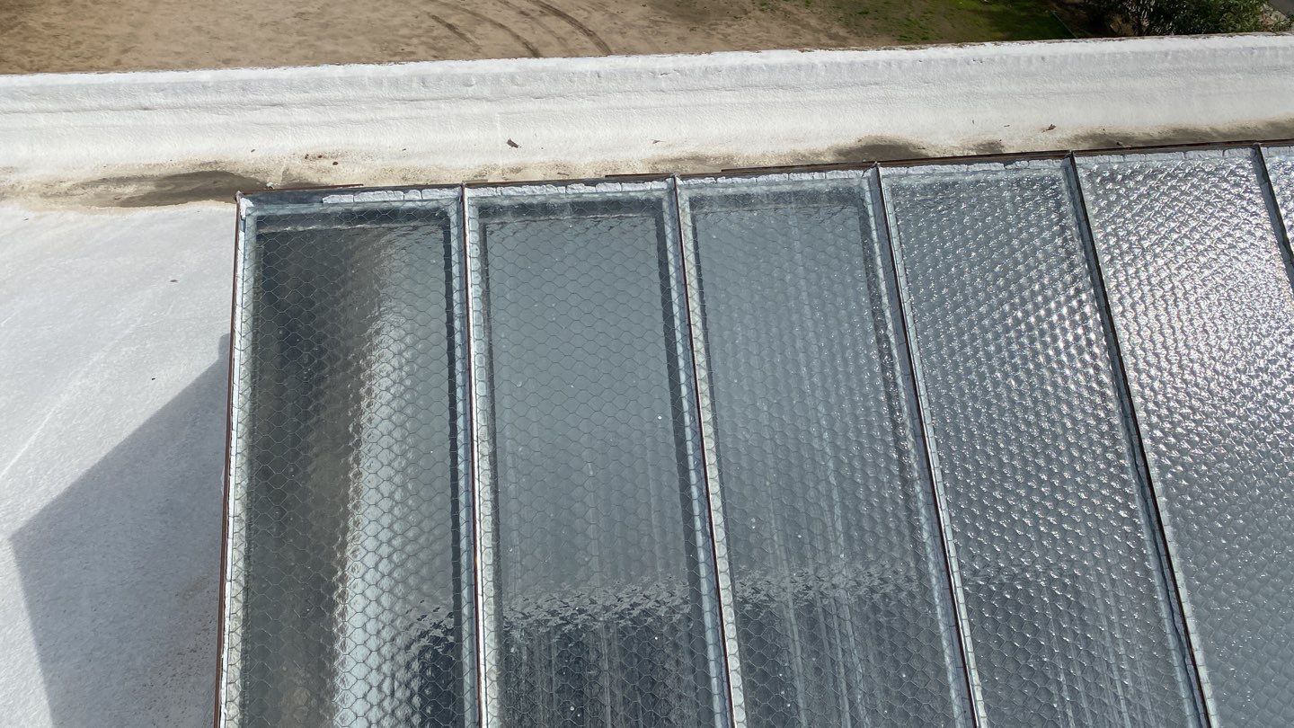 Polyurethane foam roof refurbish and recoating by Straight Edge Roofing Inc