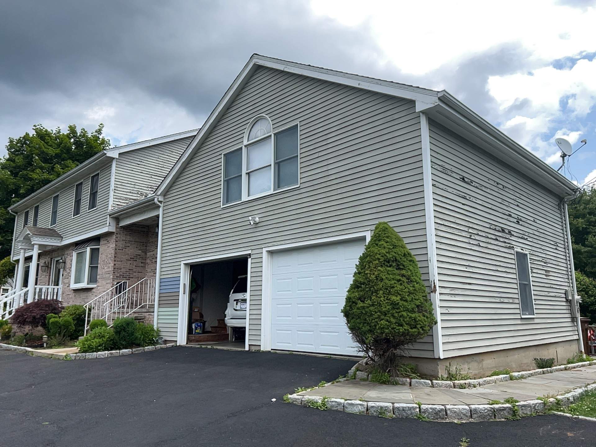 Siding Installation using Mainstreet Colonial & White gutters by A Plus Exterior