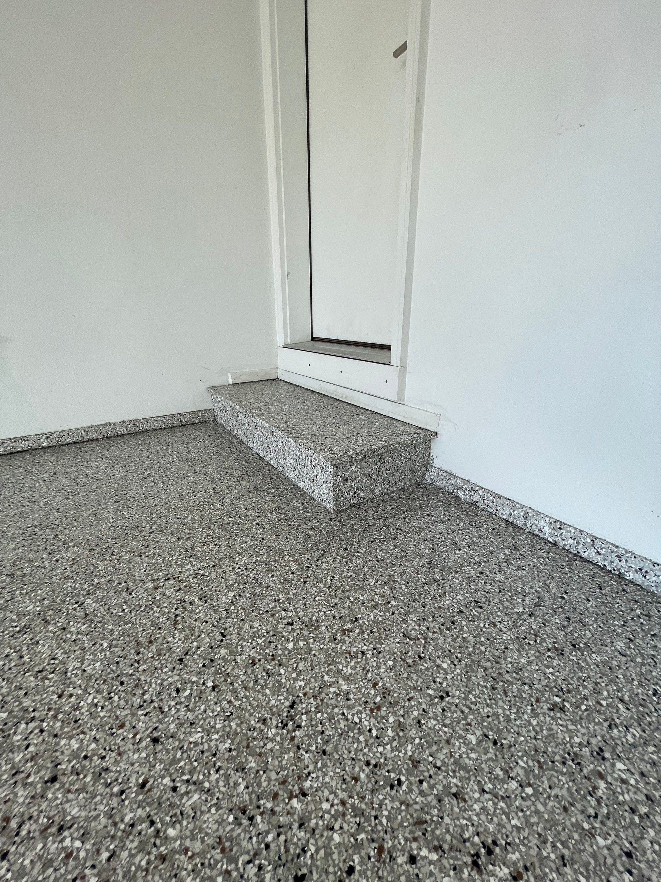 Yankton Garage Floor Restoration with Gray Speckled Epoxy Coating by Select Painting, Coatings & Garage Cabinets