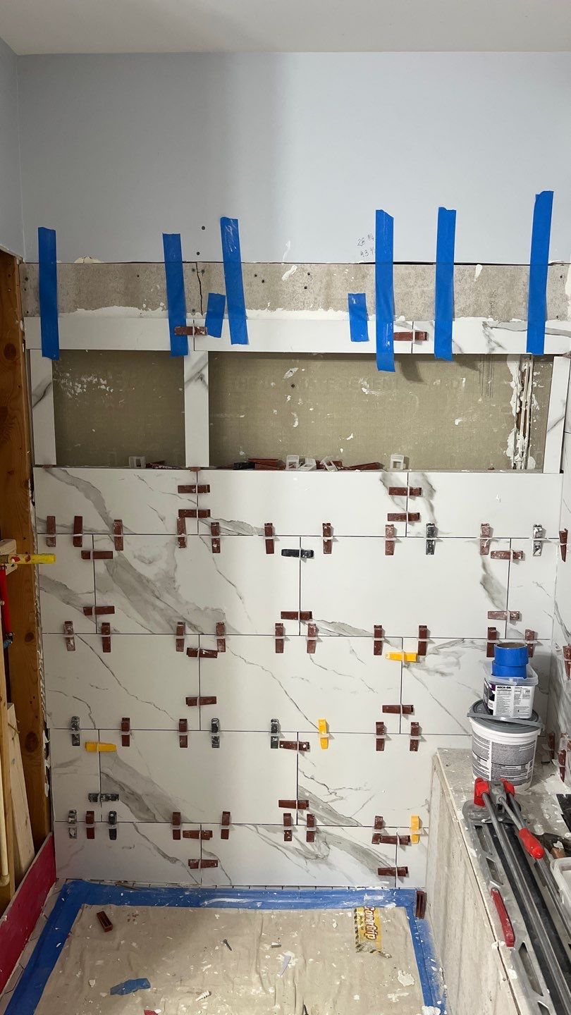 Tub to walk-in shower conversion, and tile flooring by Prudencio