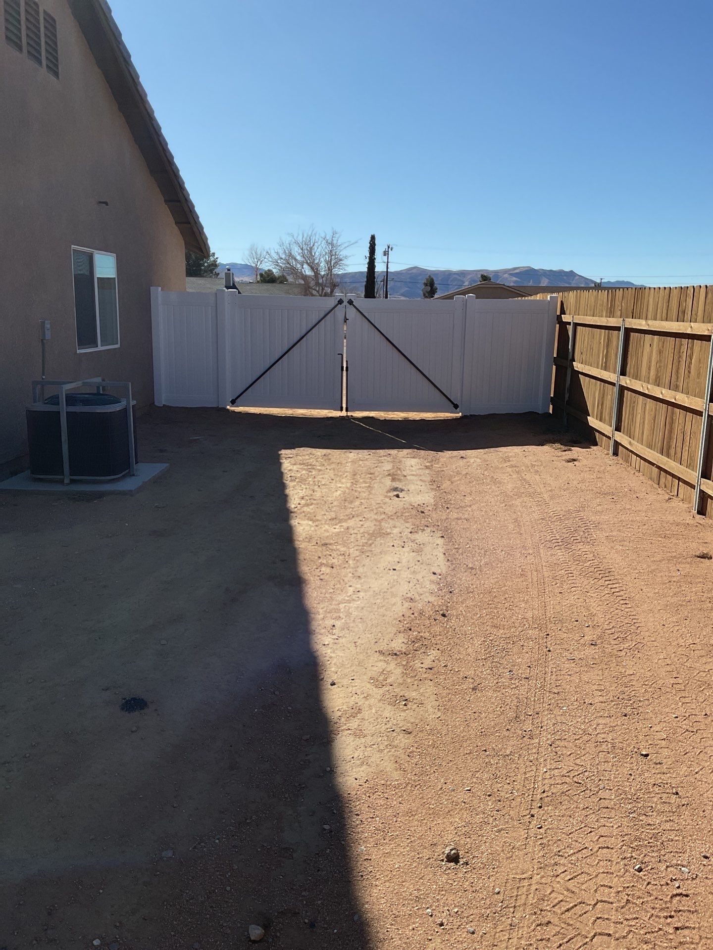 Gate installation using Vinyl by Fence Guys Inc. 