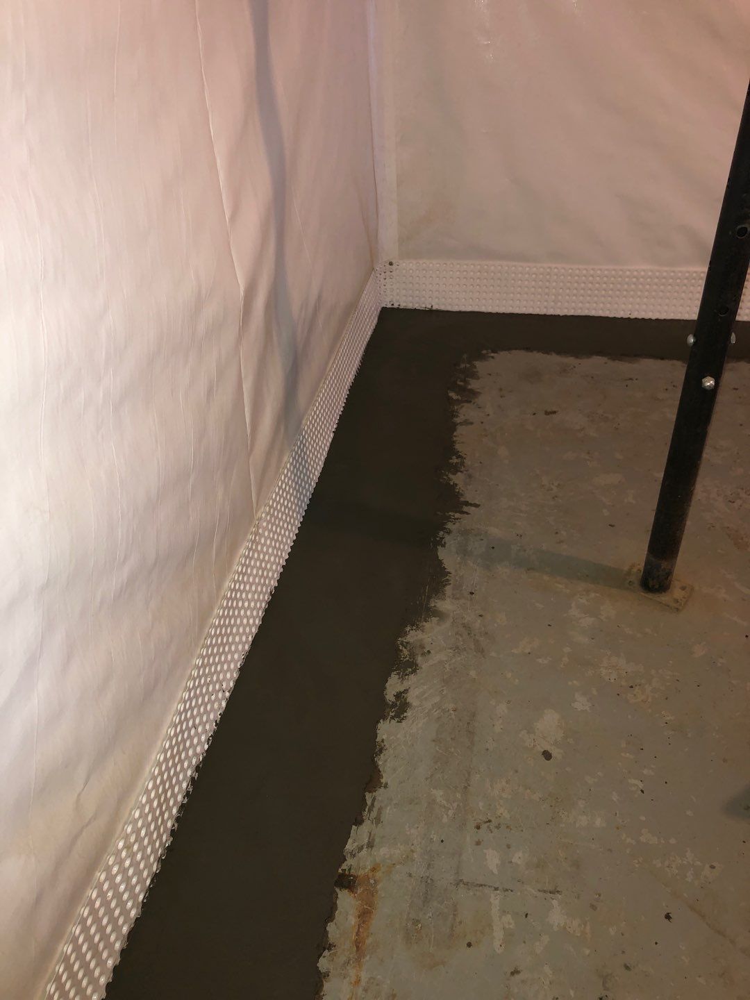 Basement Waterproofing using Drain tile system and a foundation wrap by ACE Waterproofing & Basement Solutions