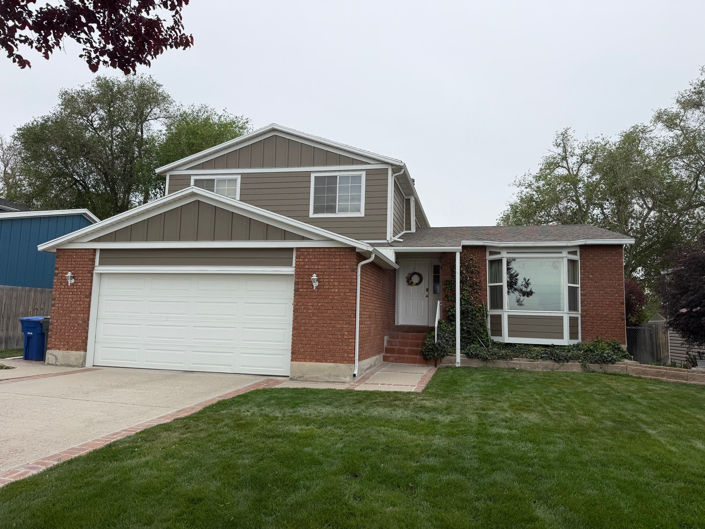 West Valley City | Aluminum to Hardie Conversion | Timber Bark & Arctic White by Ideal Siding Utah