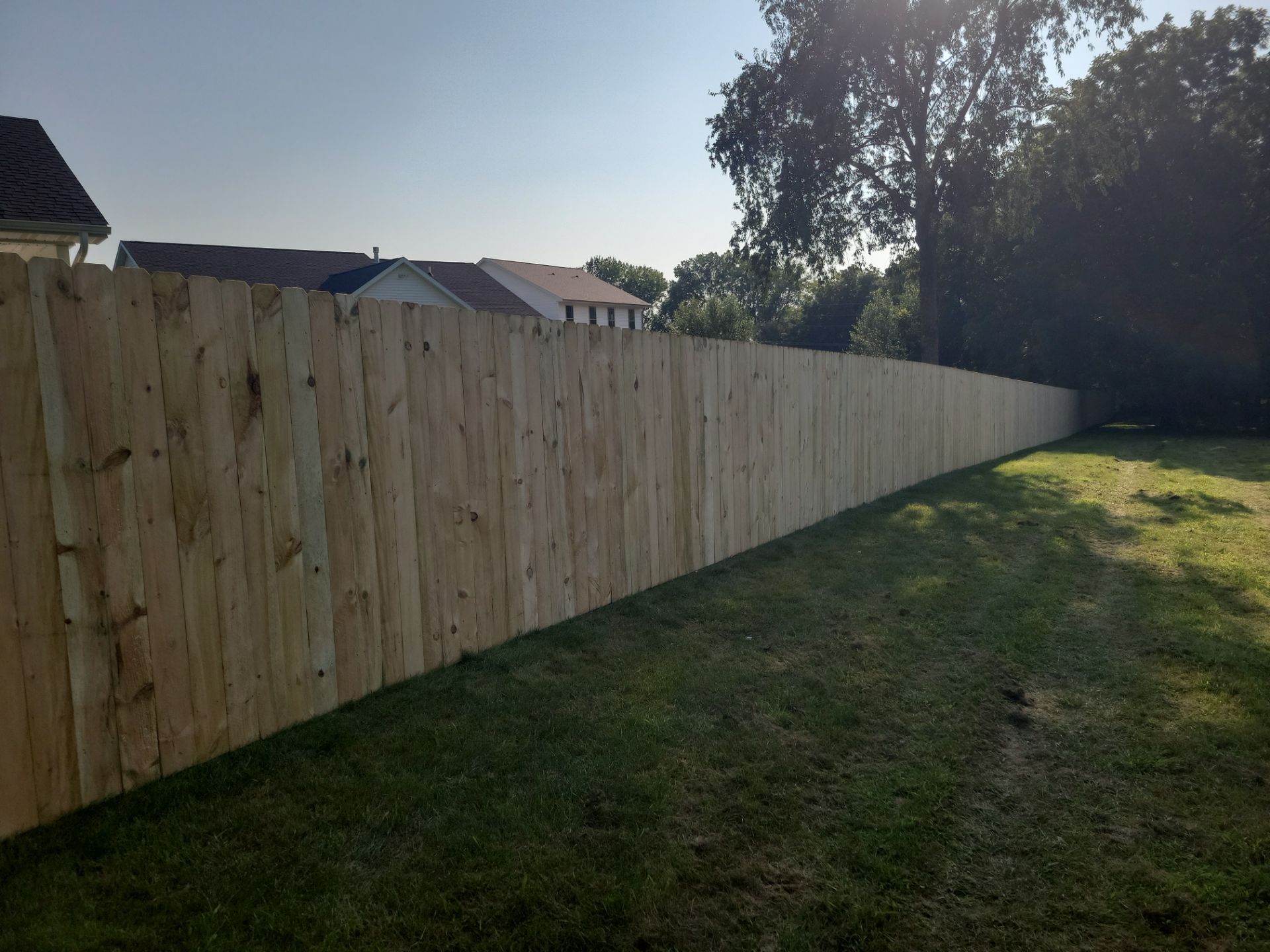 Pressure-Treated Wood Privacy Fence Replacement in Cedar Falls by Perfect Picket Fence and Stain