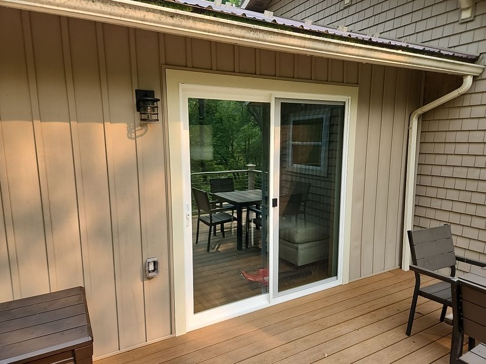 Deck installation using cable railing. by Burke Home Services