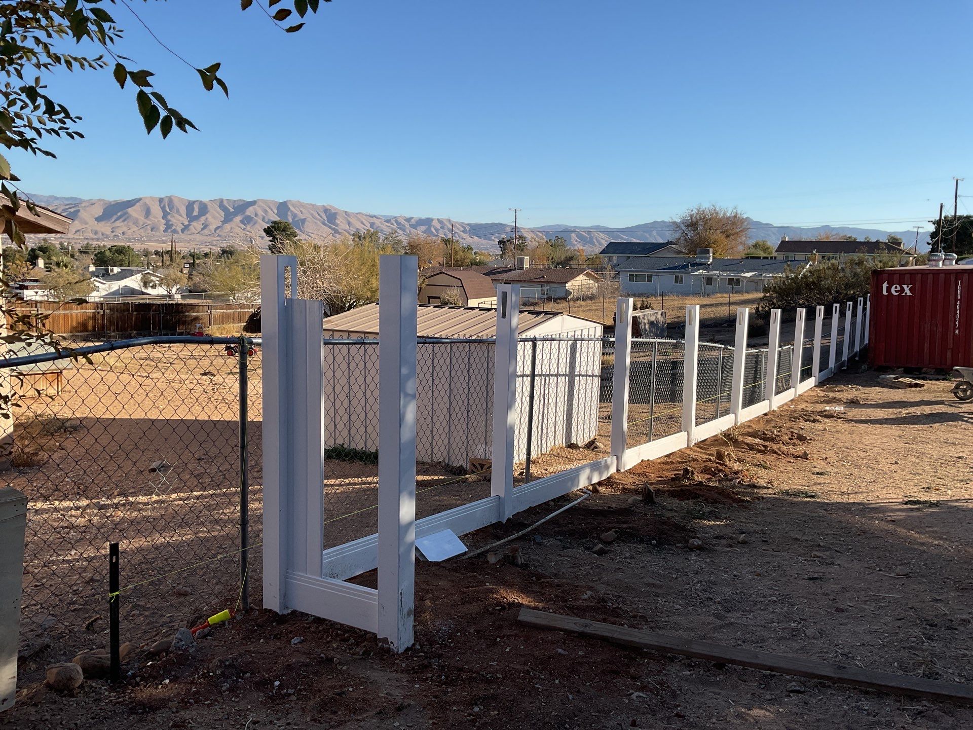 Fence Installation using vinyl and chain link  by Fence Guys Inc. 