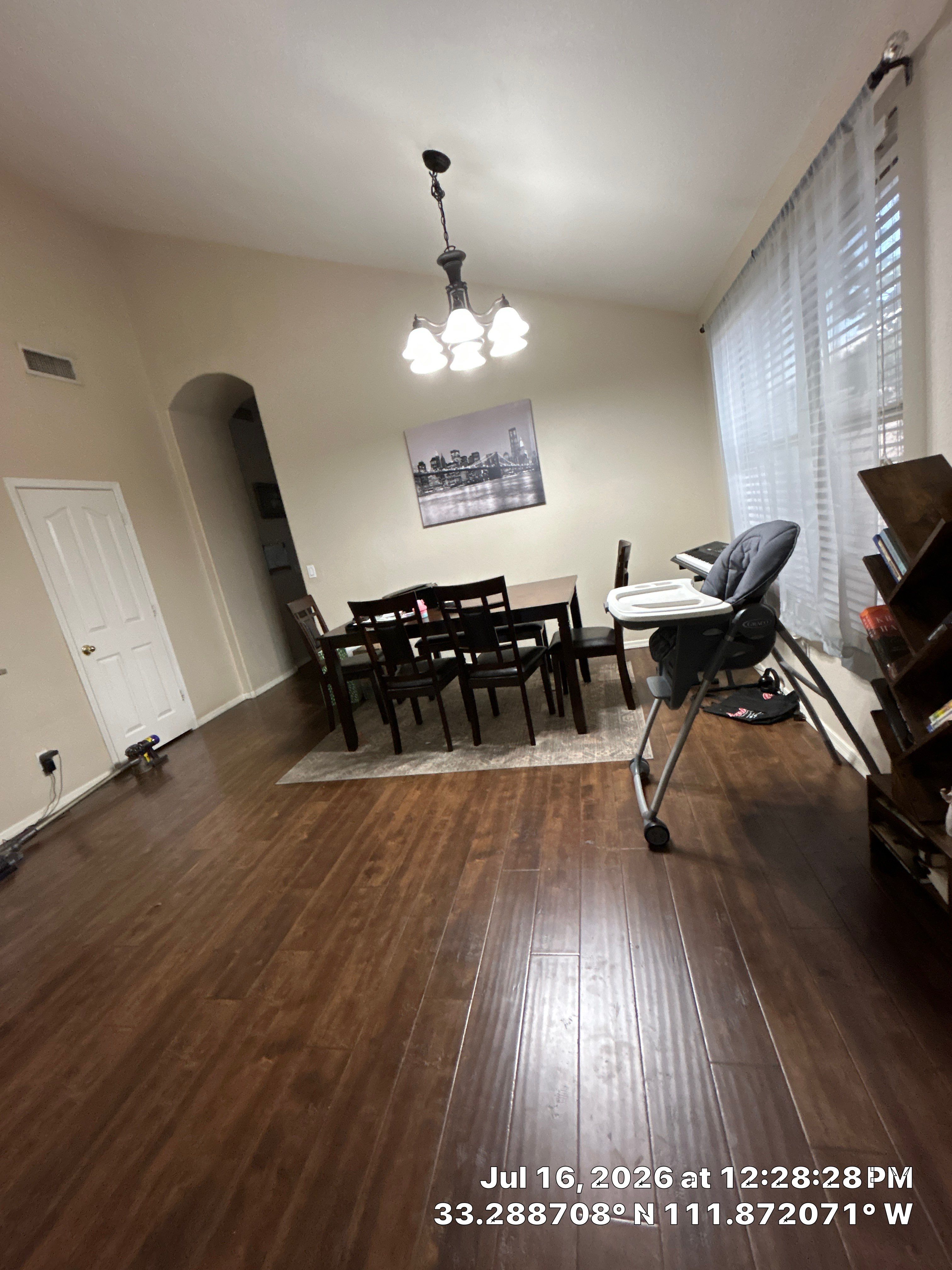 Dark Wood Laminate Flooring Installation for Chandler Dining Room by CompanyCam Sales Demo