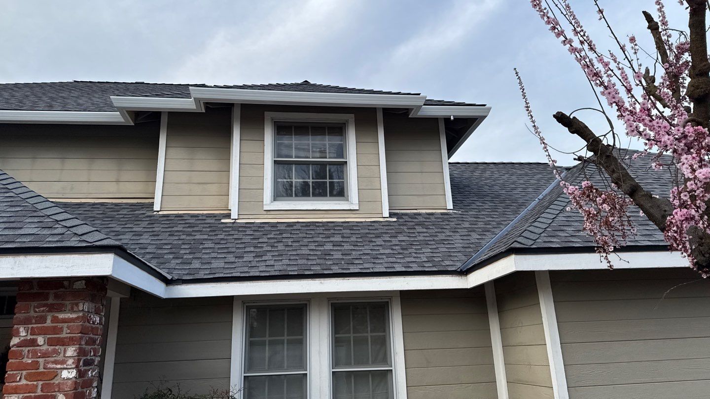 New shingles and gutters using GAF Timberline HDZ shingles and aluminum gutter by Straight Edge Roofing Inc