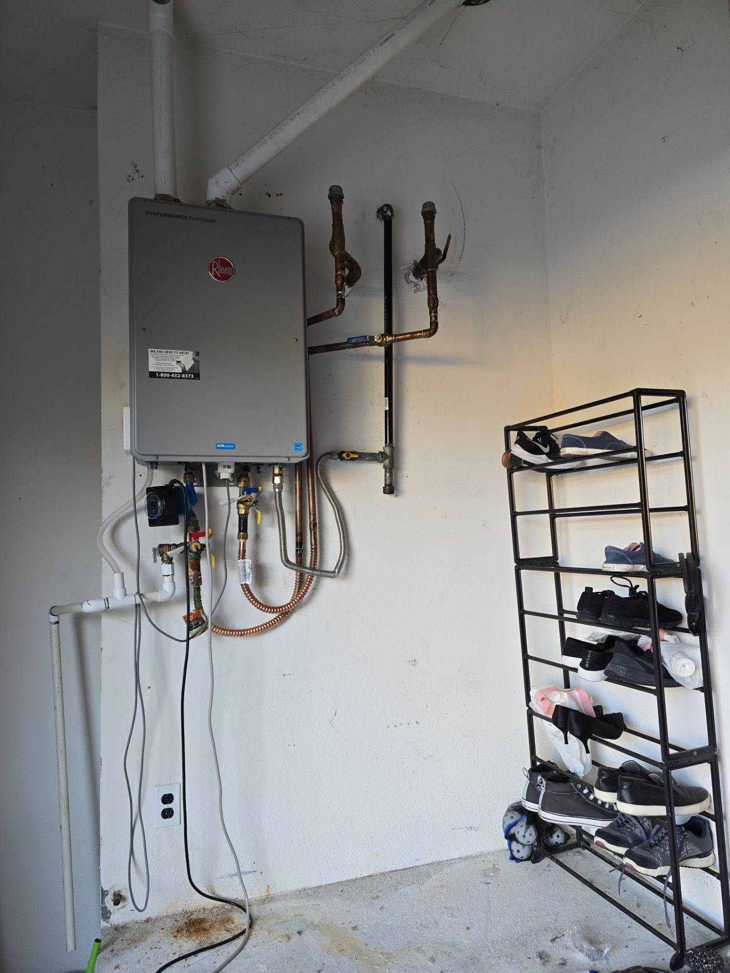 Installing a New Tankless Water Heater by Us Plumbing 