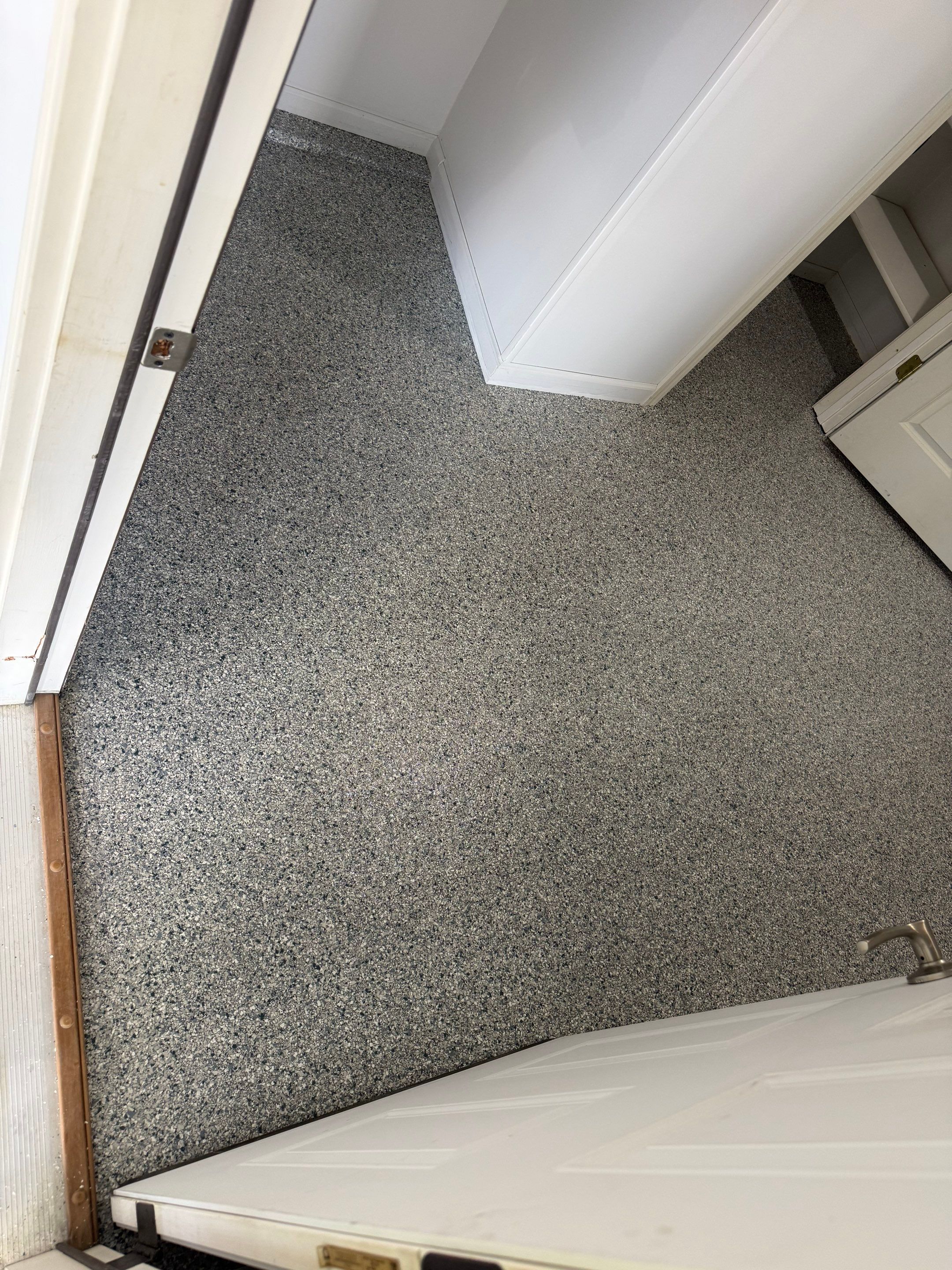 Decorative Chip Epoxy Floor Coating Installation in Sioux Falls by Select Painting, Coatings & Garage Cabinets