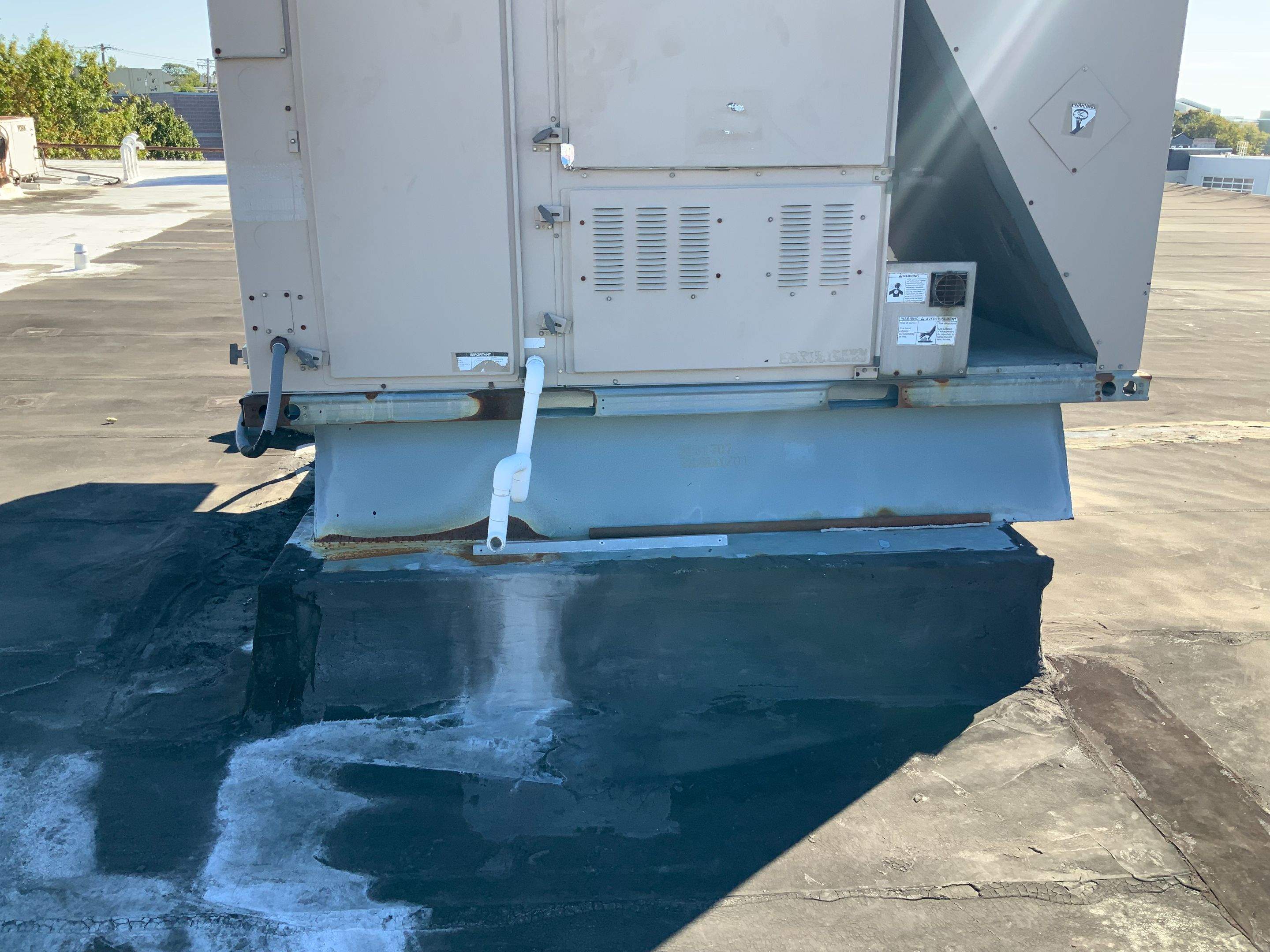 Commercial Roofing Repair using new Flashing by Alpha Design Services