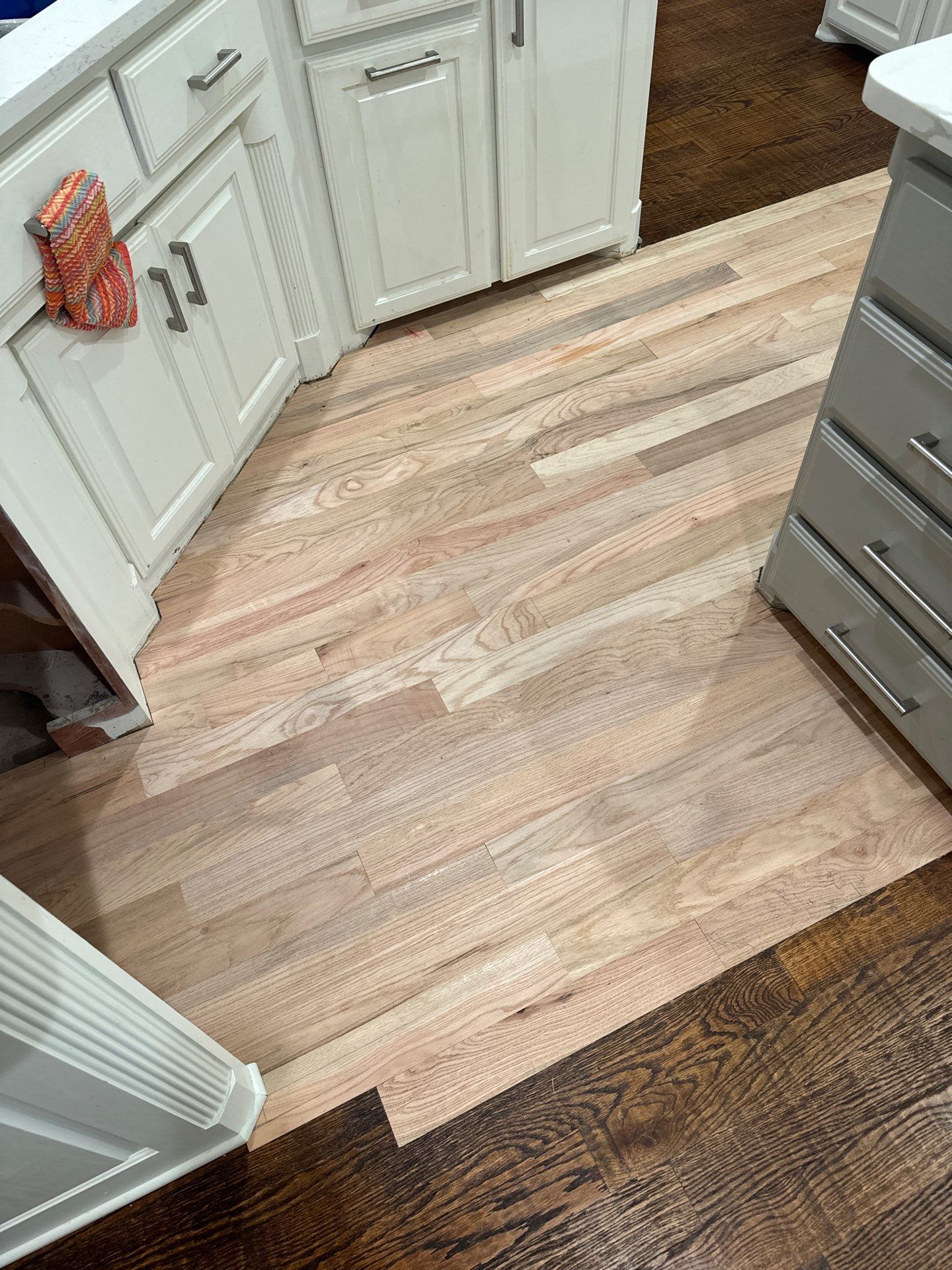 Dishwasher Flood Repair by Fine Line Flooring Inc.