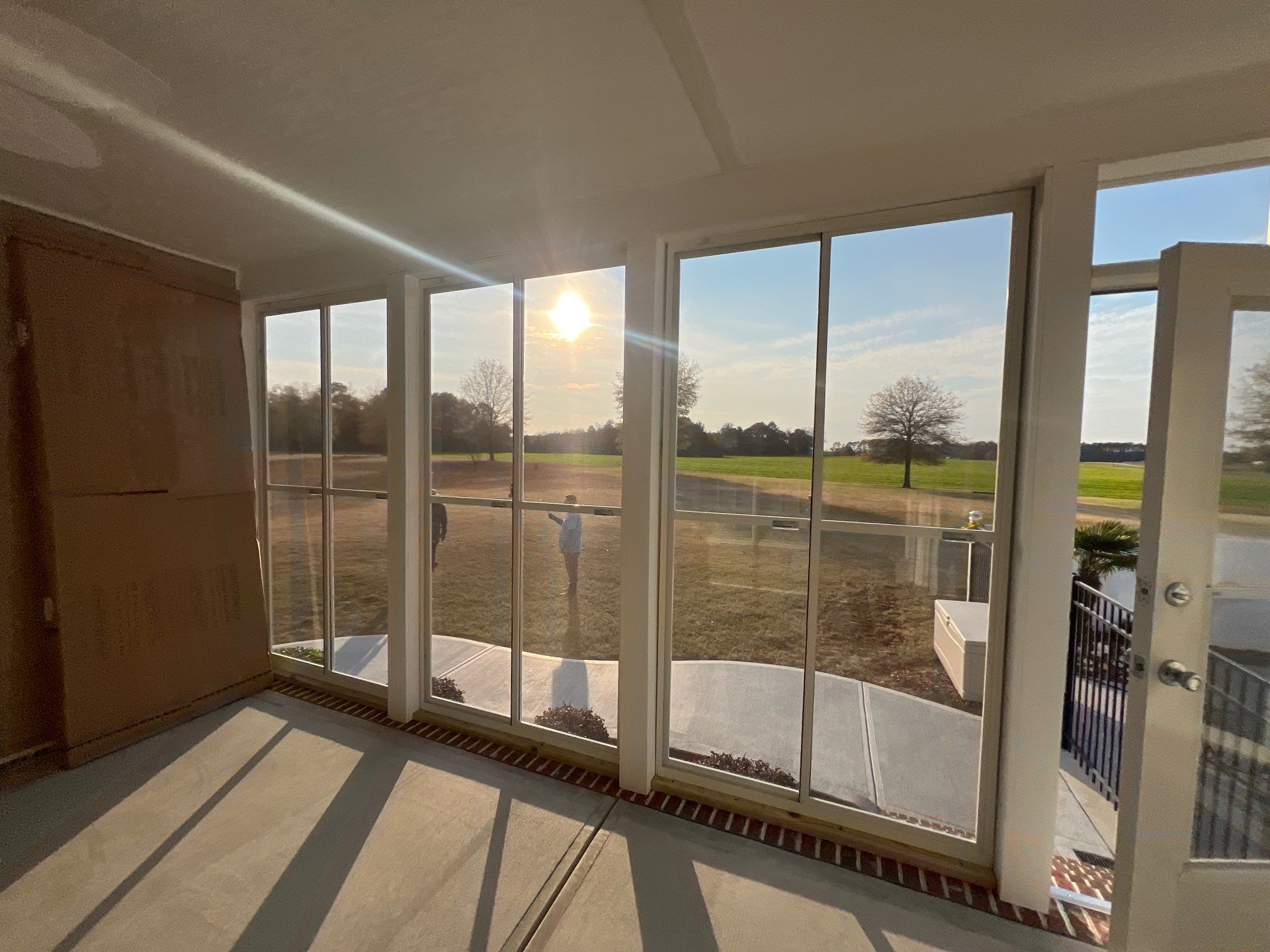 Custom Screened Porch and Concrete Walkway Installation in Rocky Mount by The Remodeling Company