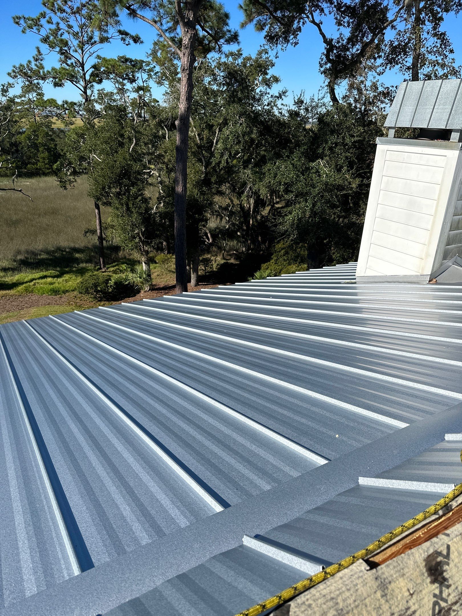 Roof Replacement using Standing Seam Metal by Rainstoppers Roofing