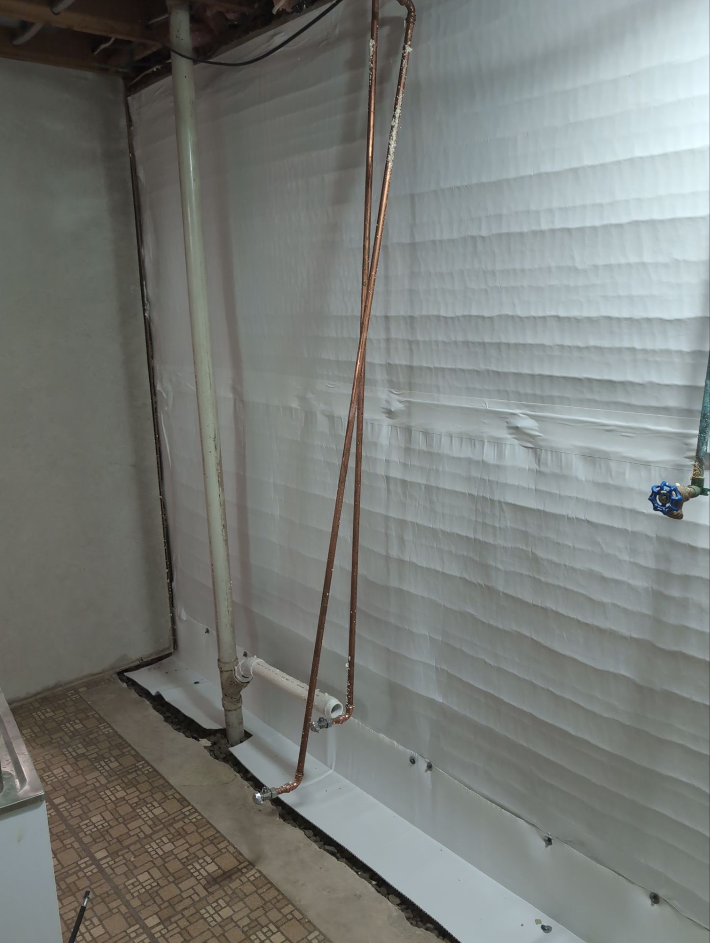 Interior Basement Waterproofing System and Egress Window Installation by Toledo Basement Repair 