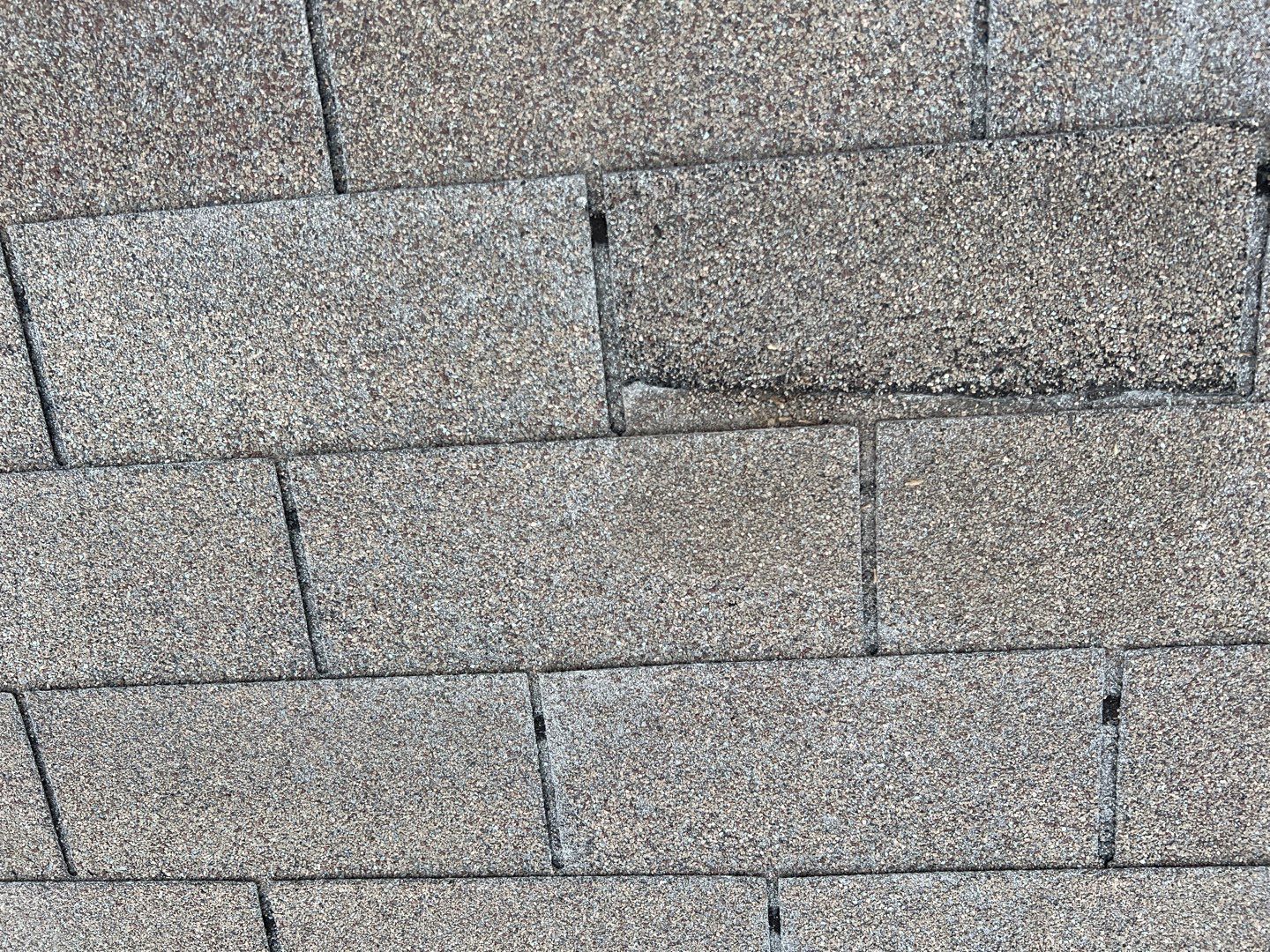 Wind damaged roof replacement by Oakwood Roofing and Construction, LLC