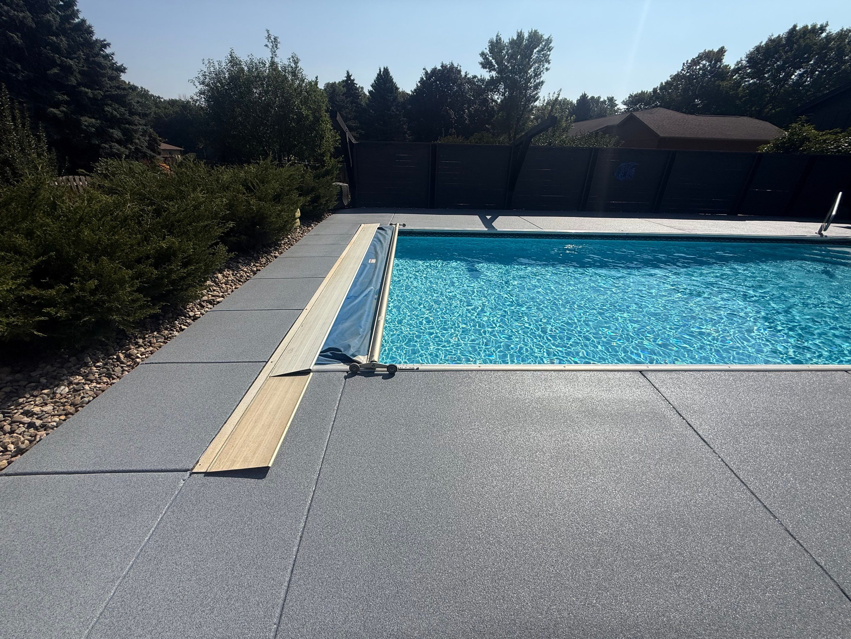 Garage Floor and Textured Pool Deck Coating in Sioux Falls by Select Painting, Coatings & Garage Cabinets