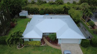 Residential Roofing Installation using 1" Nail strip metal roof