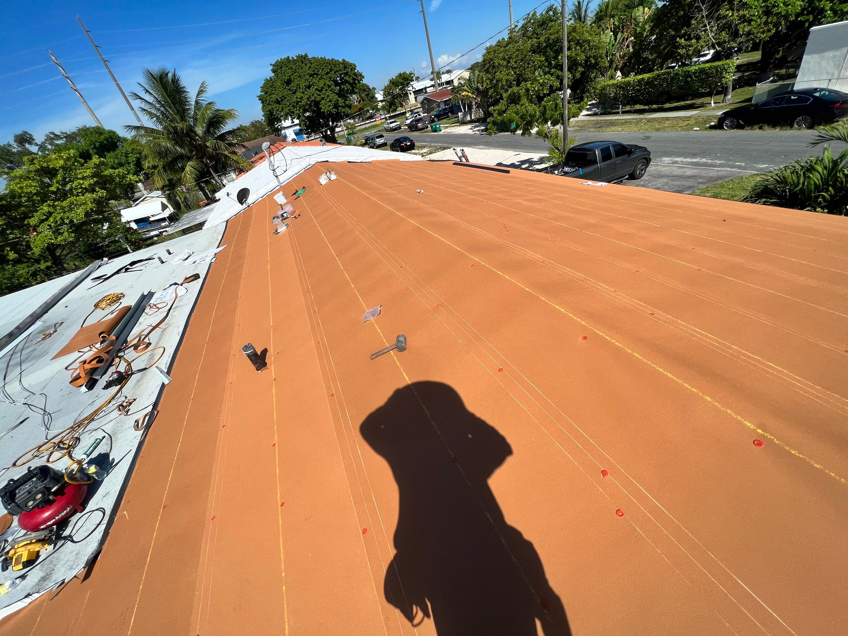Standing Seam Metal & Flat Re-Roof using 1.5" Nail Strip 24ga Black Matte Kynar Coated Standing Seam Metal Panels by Morton Roofing, Inc.