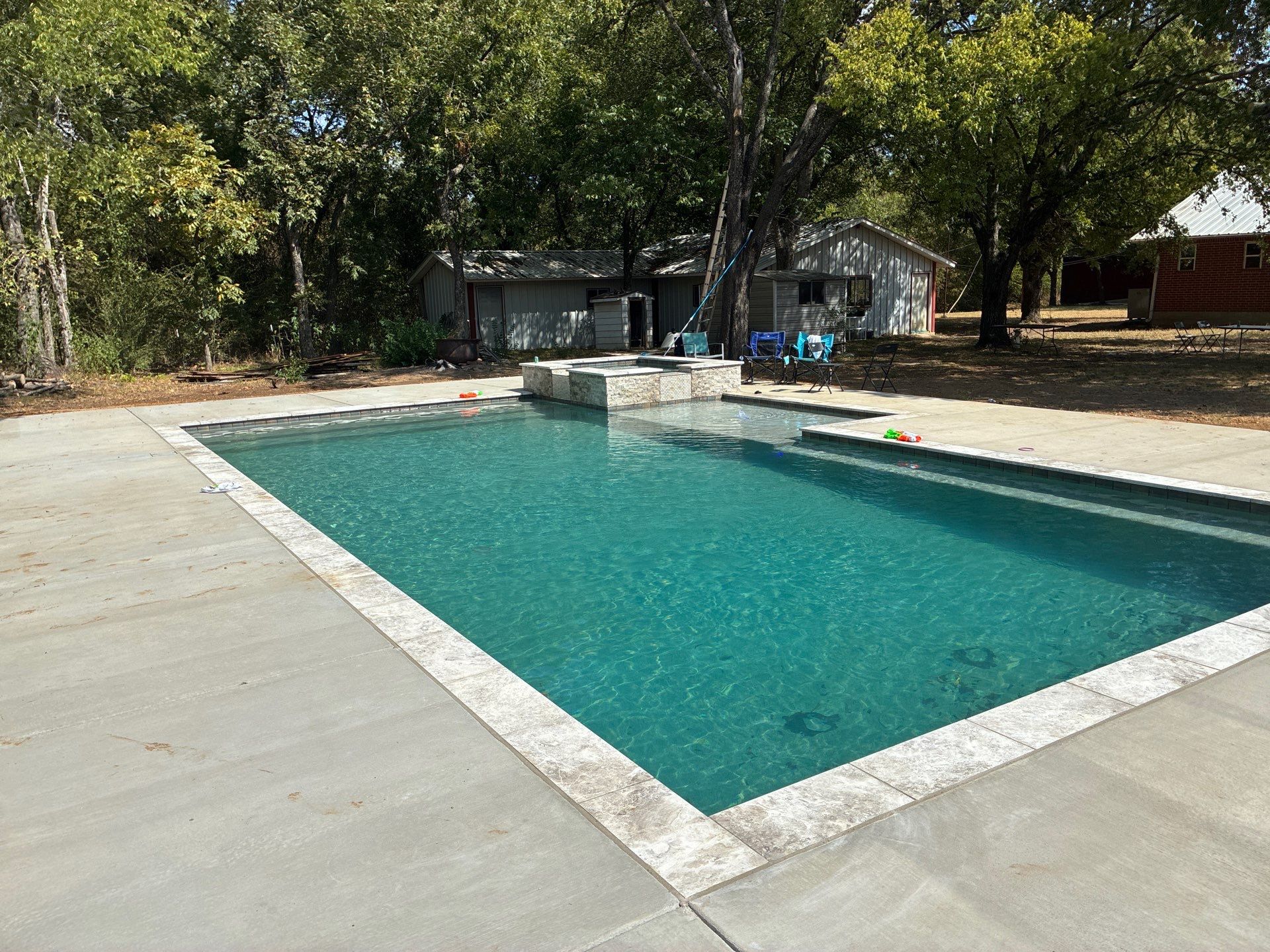 Classic Rectangular Pool with Travertine Deck by Pinnacle Pools and Spas - DFW