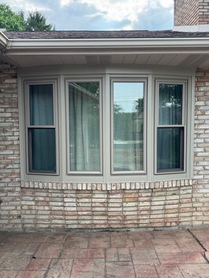 Four-Panel Bay Window Installation with Beige Trim in Weirton