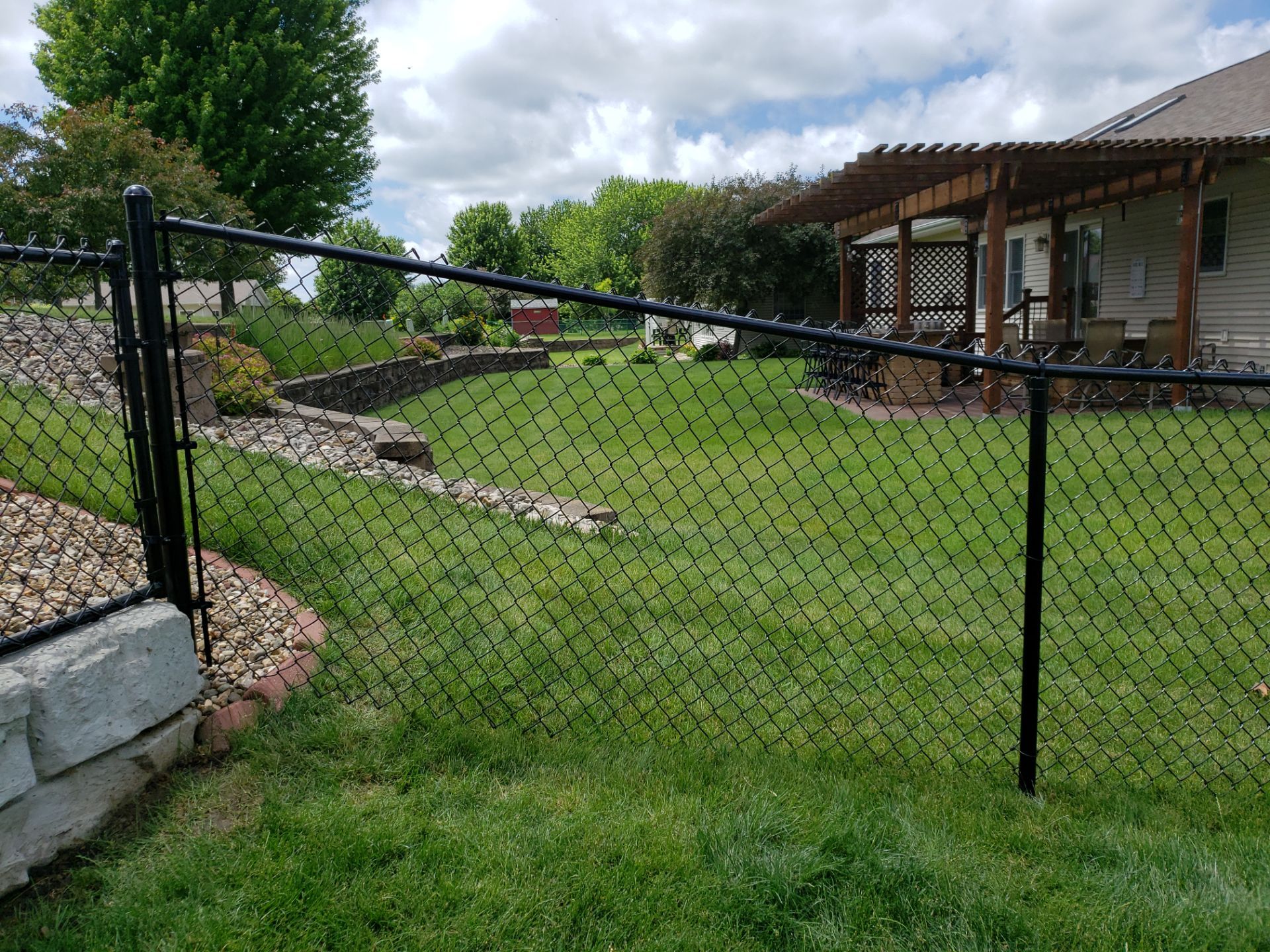 Black Vinyl-Coated Chain Link Fence Installation in Denver by Perfect Picket Fence and Stain