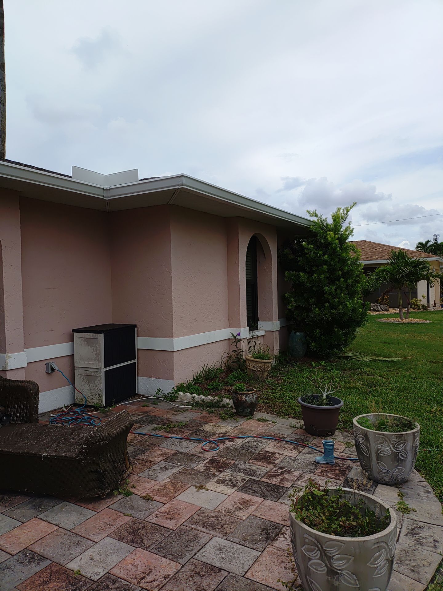 Replace gutter using White Down Spouts in Cape Coral FL by Gutter Professors