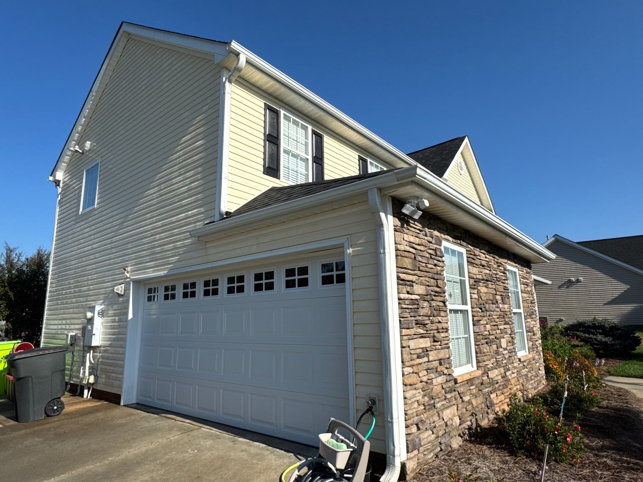 the service involves cleaning siding and stone surfaces of the house to remove dirt and grime for a fresh appearance