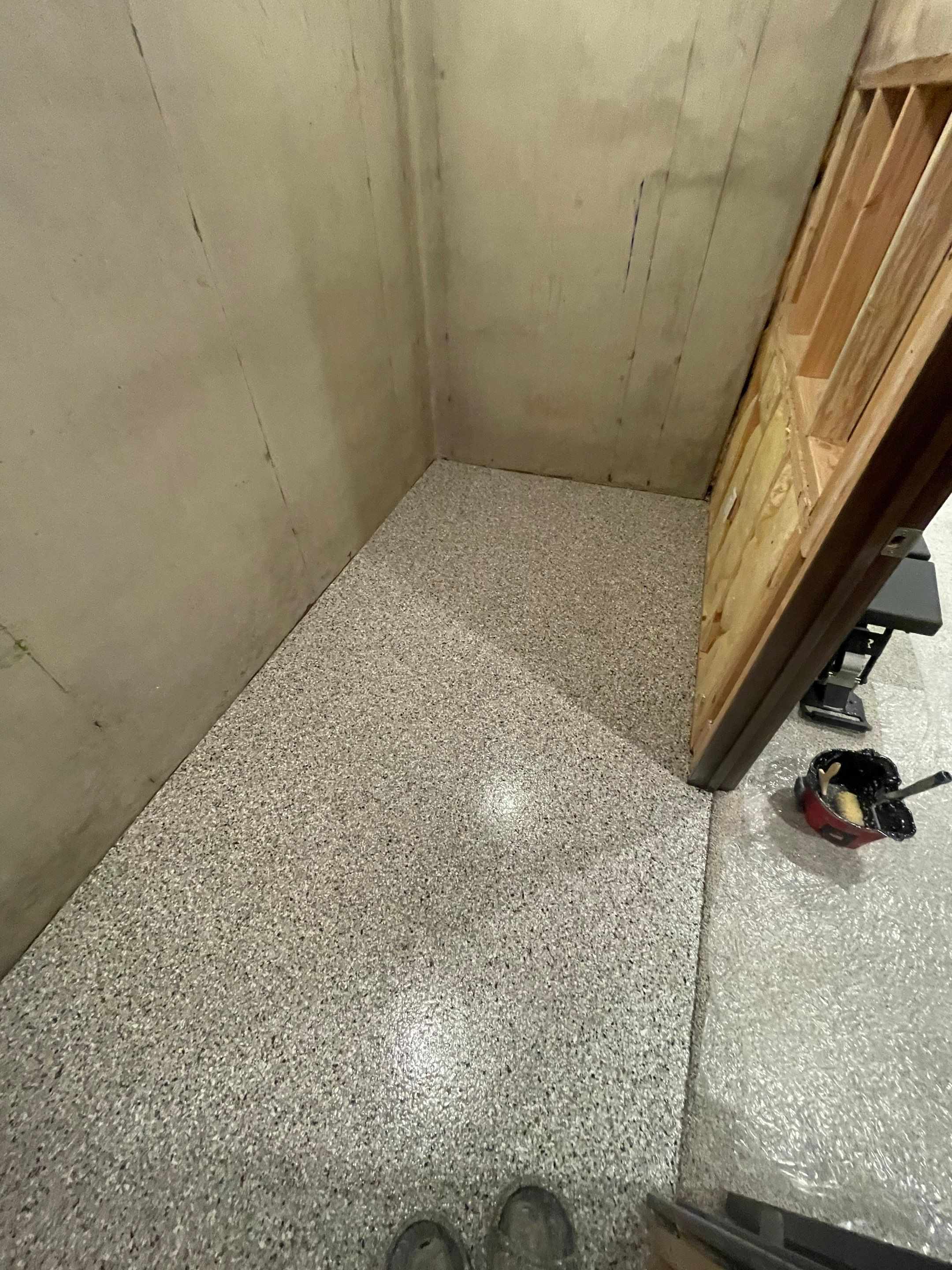Sioux Falls Basement Floor Transformation with Durable Epoxy Flake Coating by Select Painting, Coatings & Garage Cabinets
