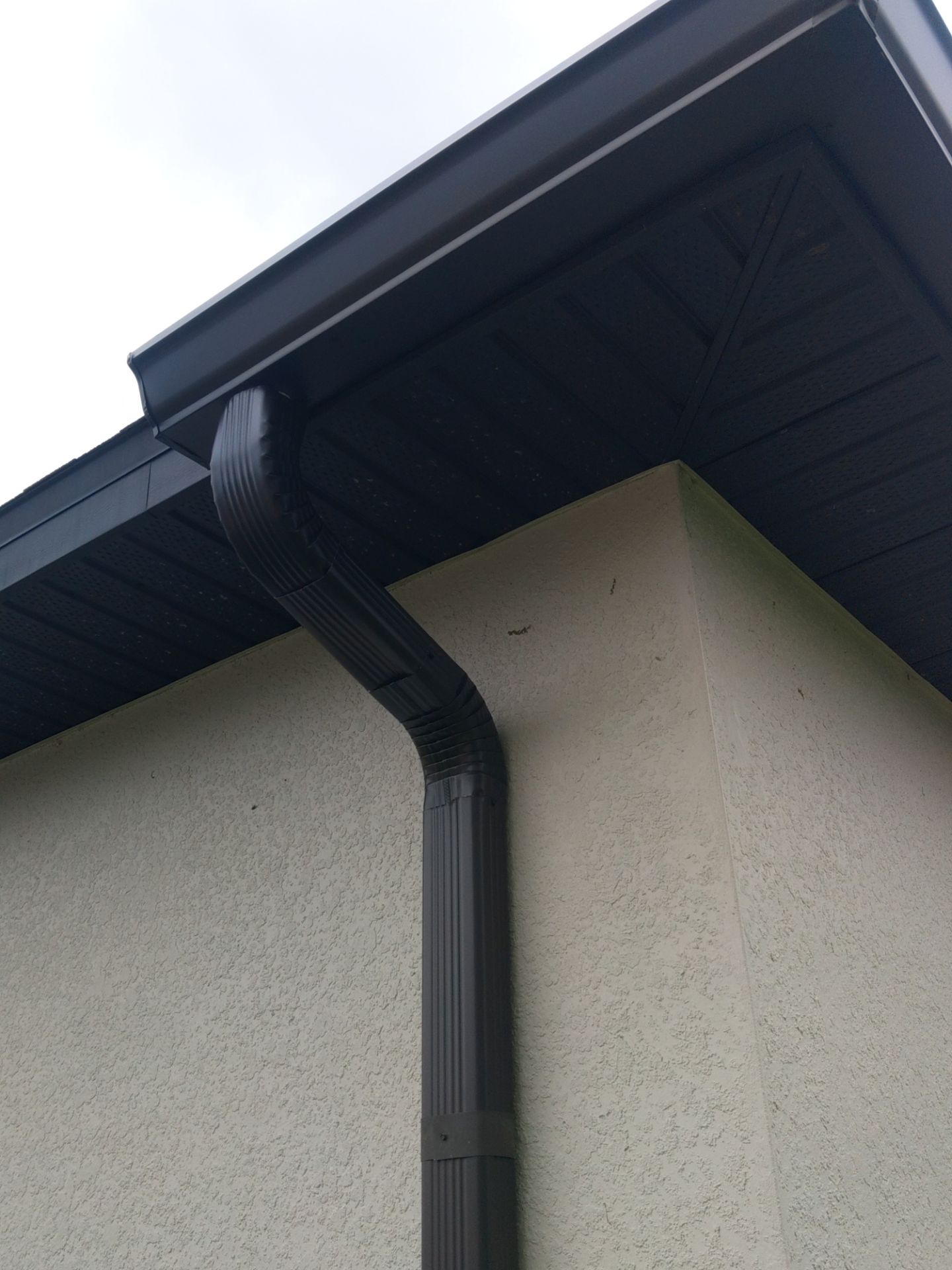Black Seamless Gutters using black seamless gutters in Cape Coral FL by Gutter Professors