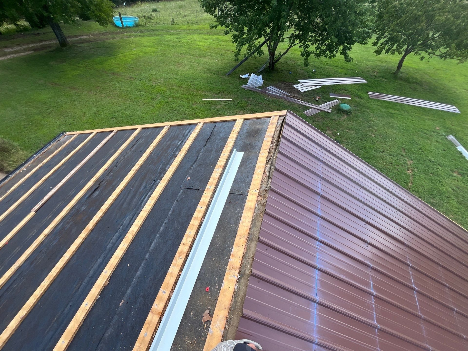 Residential Roofing Install - 29 Gauge G-Rib Metal - Color Brown & Crimson Red by Titan Commercial & Residential Roofing