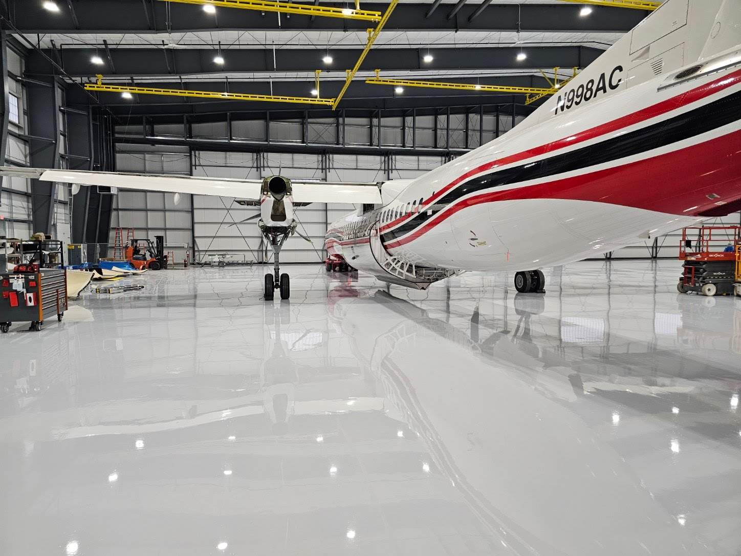 Airplane Hanger using Light Grey Commercial Penntek Epoxy by Croc Coatings, LLC