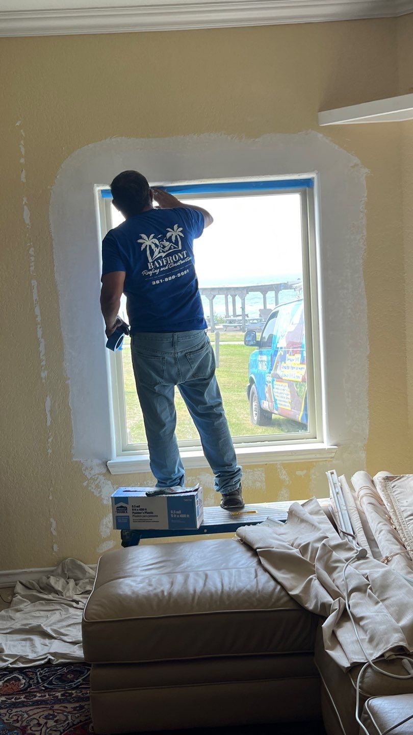 Installing Windows on a Submarine  by Bayfront Roofing and Construction