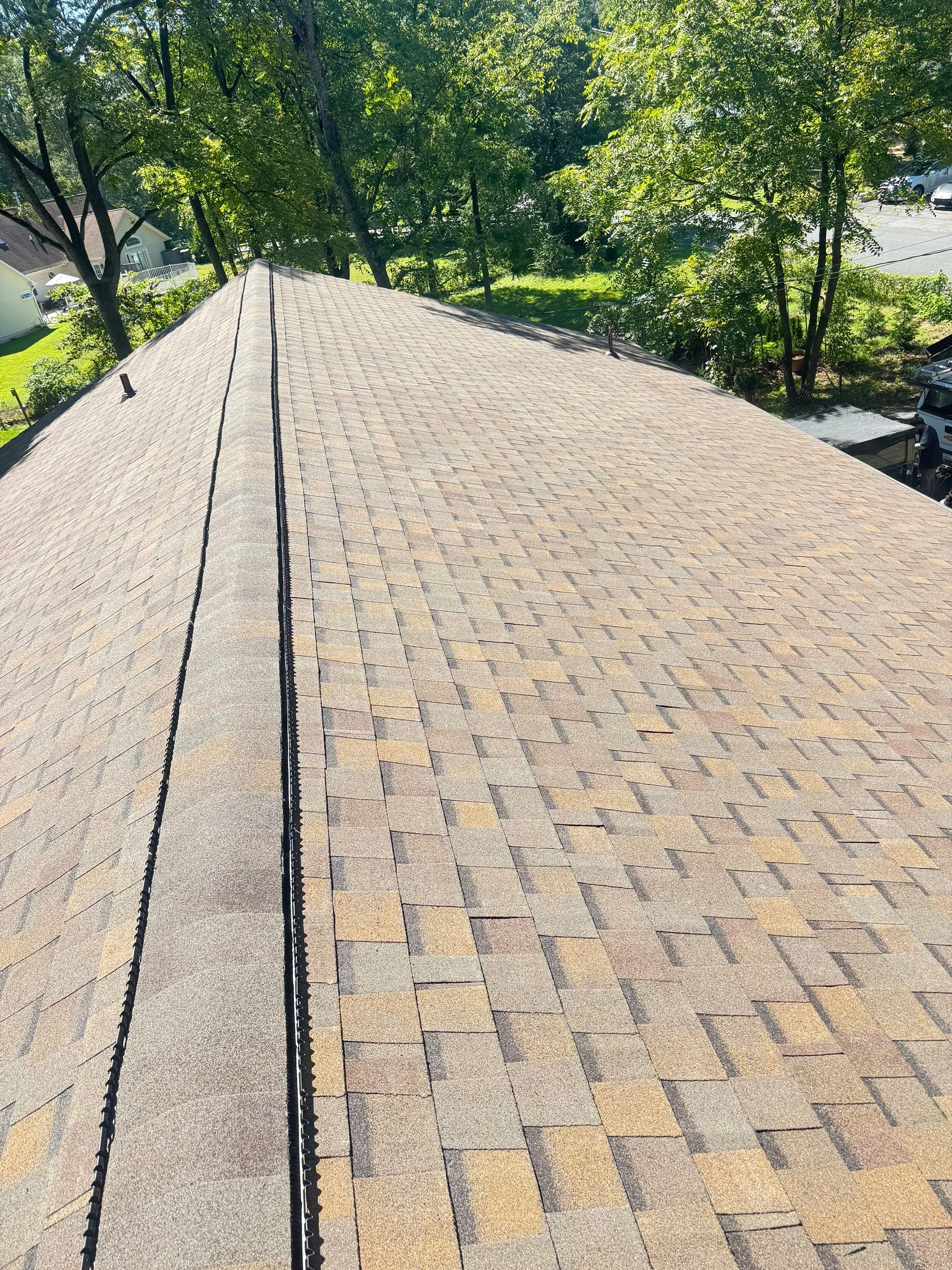 Full Roof Replacement and Gutter Guard Installation in Pasadena, Maryland by First Chesapeake Roofing