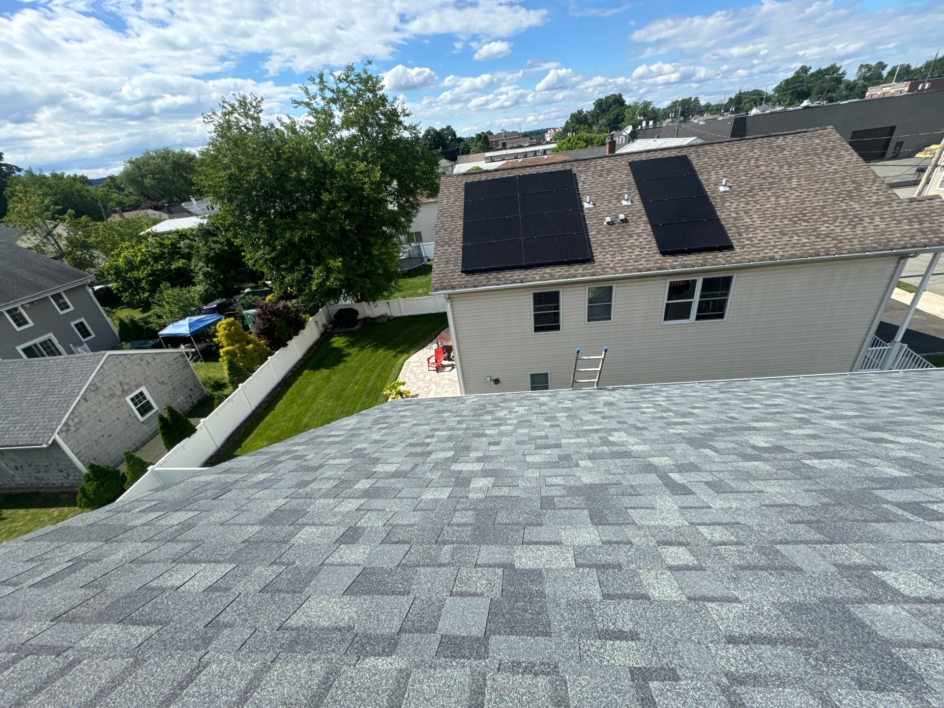 Charcoal Shingles by Reimagine Roofing