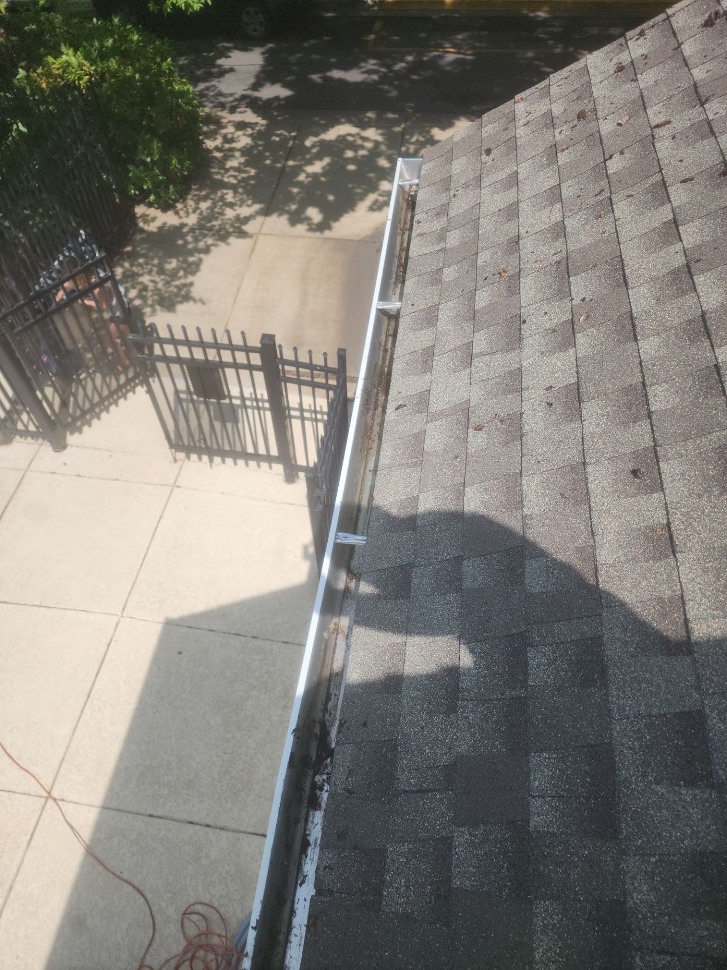 HOA gutter cleaning in Winchester, VA, after  photo showing full gutters.