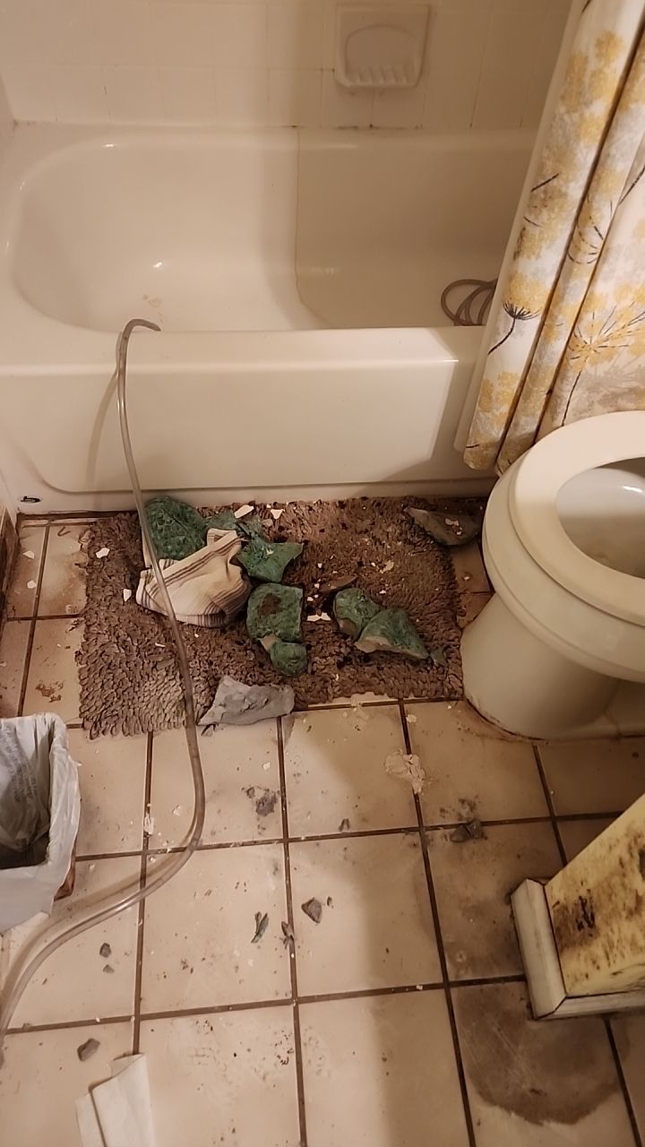 Damage caused from leaking water hea  er by Building performance Solutions LLC