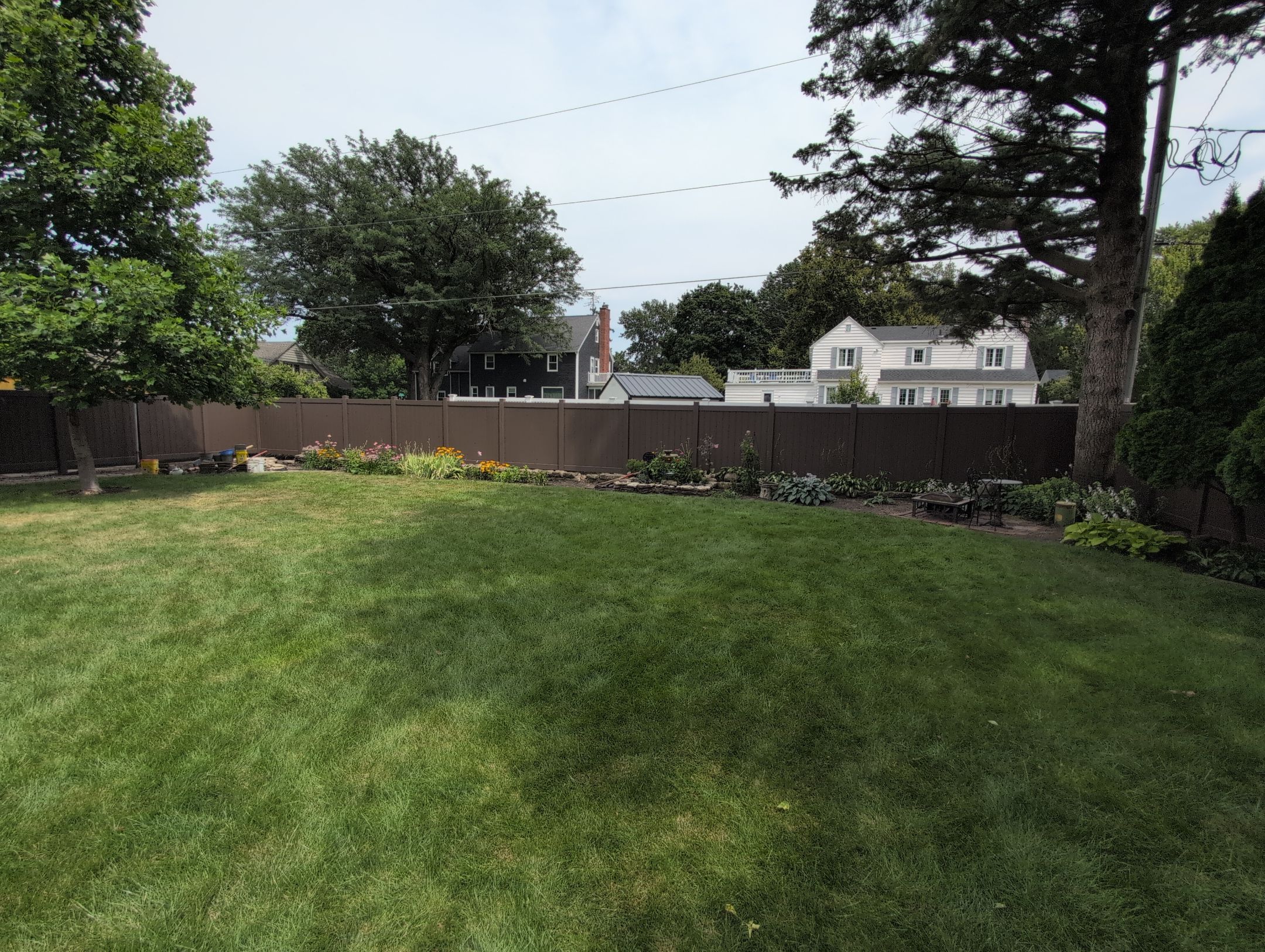 Walnut Vinyl Privacy Fence Installation in Waterloo by Perfect Picket Fence and Stain