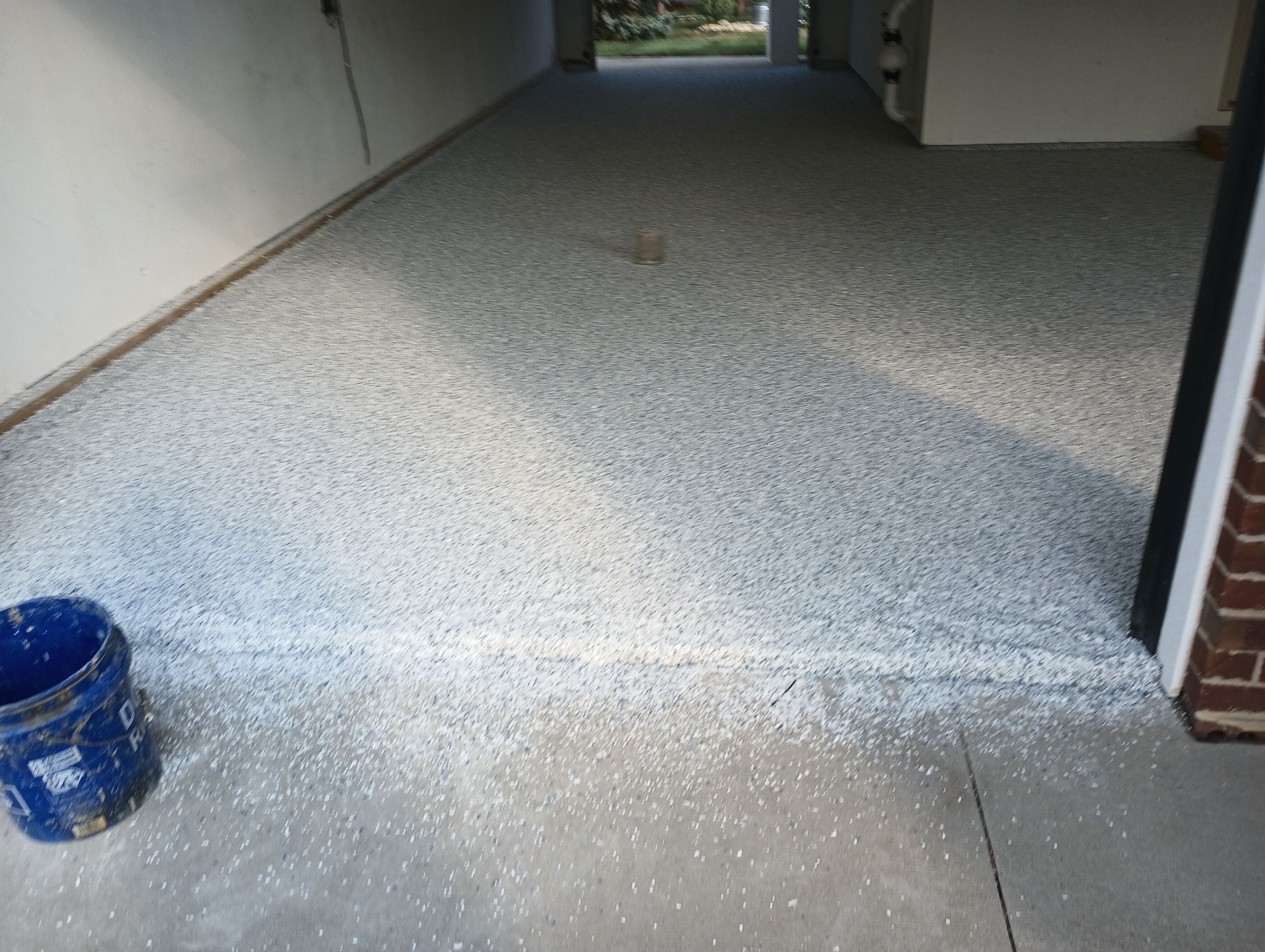 Garage Concrete Coating Installation in Sioux Falls Using Tidal Wave Finish by Select Painting, Coatings & Garage Cabinets