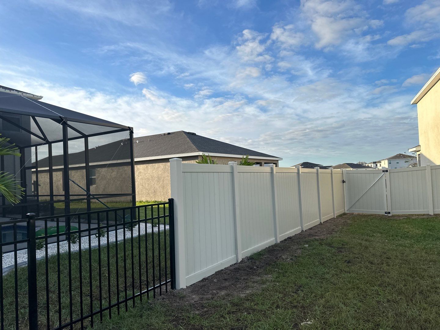 Vinyl Fence Installation using Vinyl Fence and a Black 3 Rail Aluminum Fence by Asap fence and gates, LLC